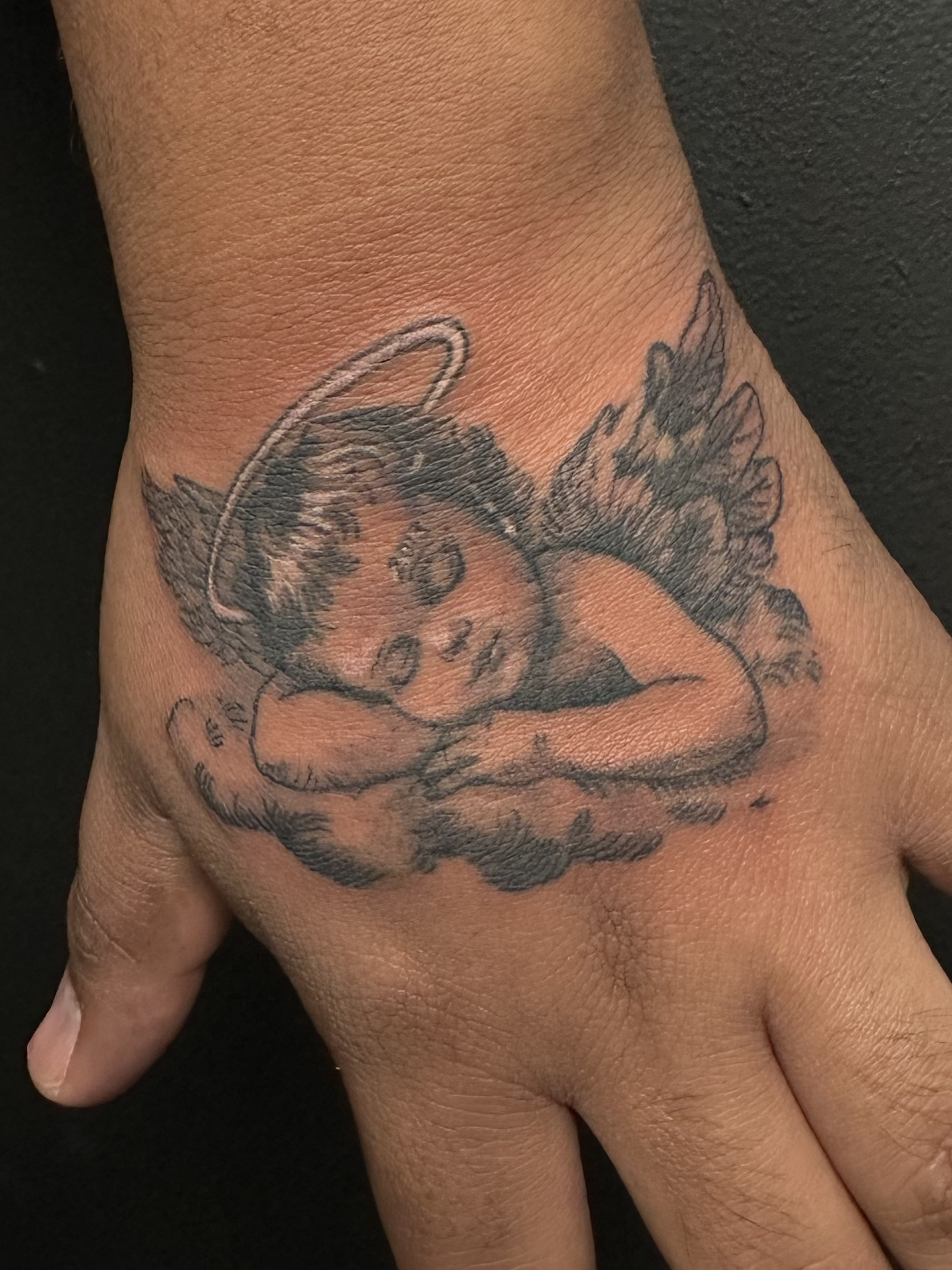 Angel on Palm Tattoo.png