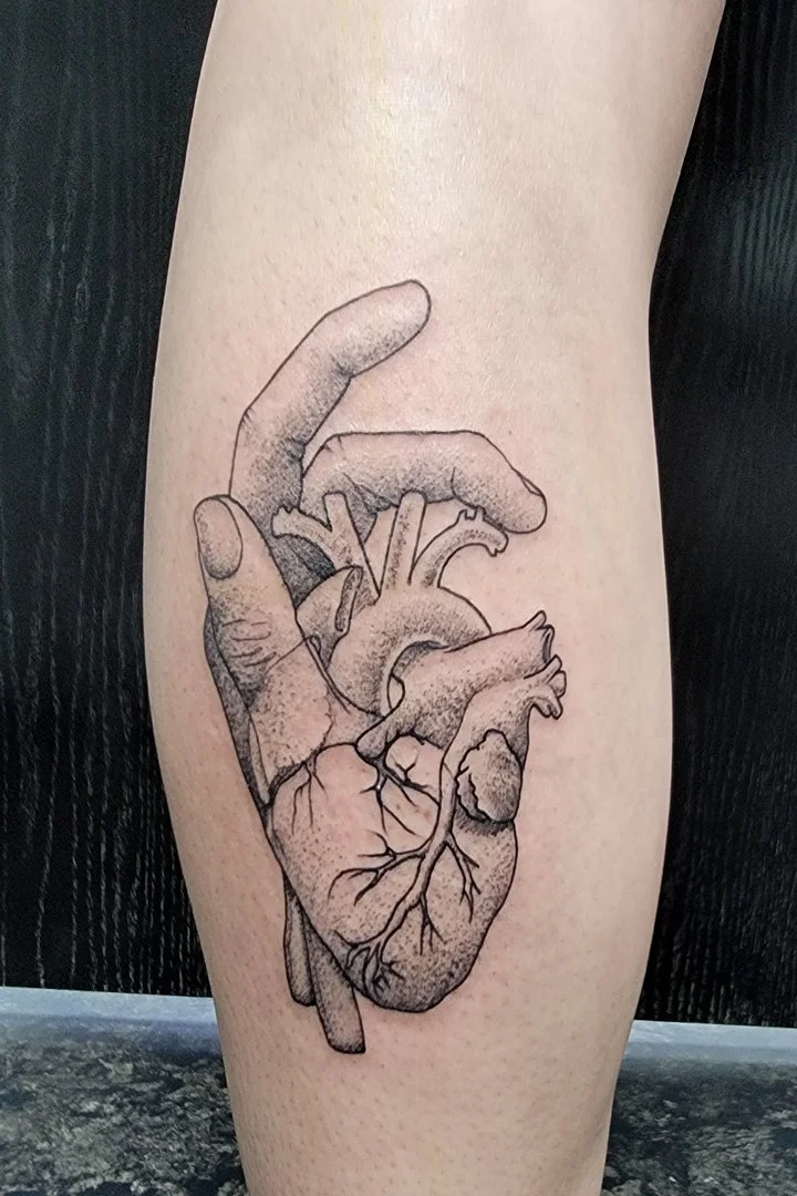 Surrealism Hand and Heart Tattoo.jpg