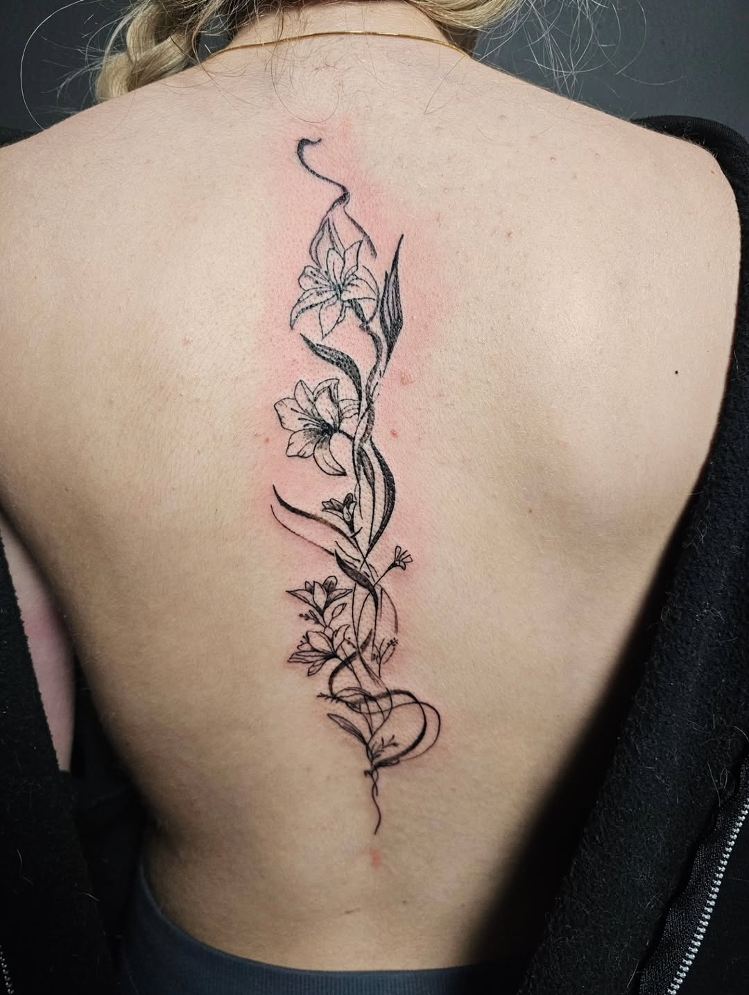 Black and Grey Flower Tattoo on Spine
