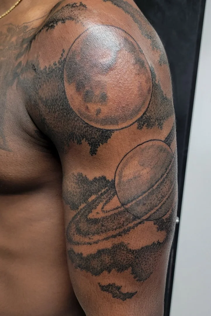 Illustrative Planets Shoulder Tattoo.jpg