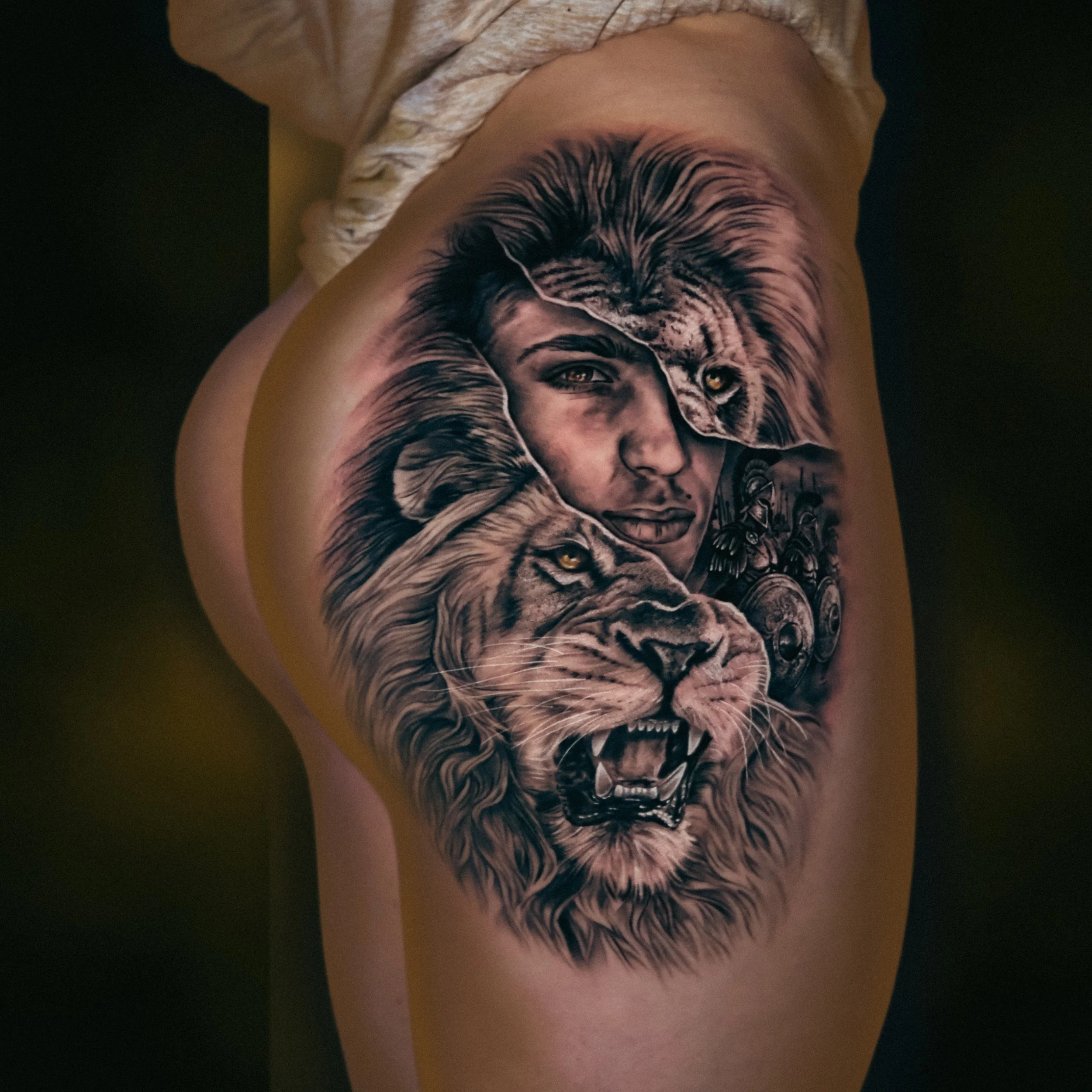 Black and Grey Realism Lion and Soldier Tattoo.JPG