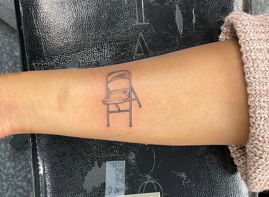 Black and Grey Folding Chair Realism Tattoo