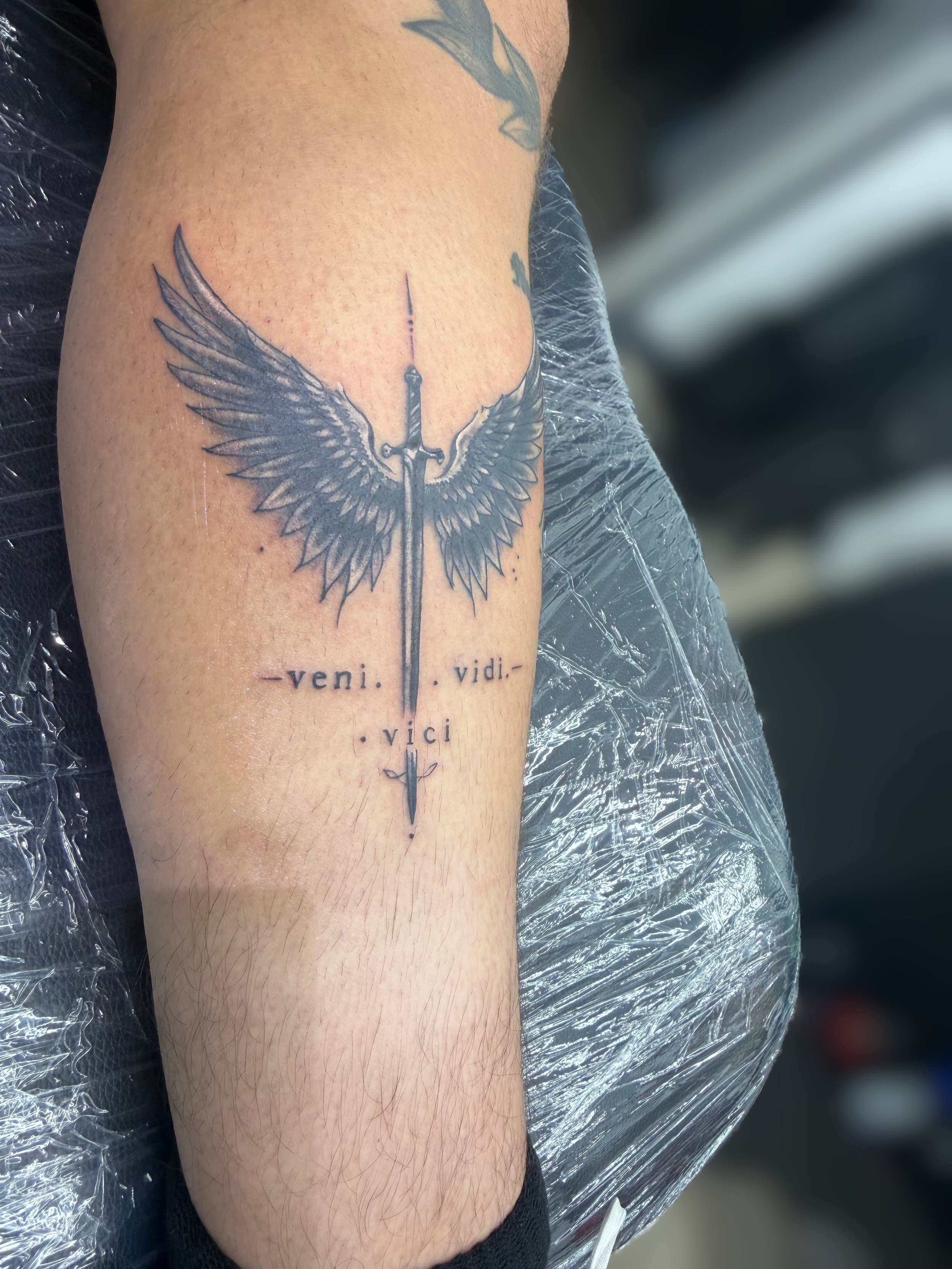 Sword and Wings Tattoo.jpg