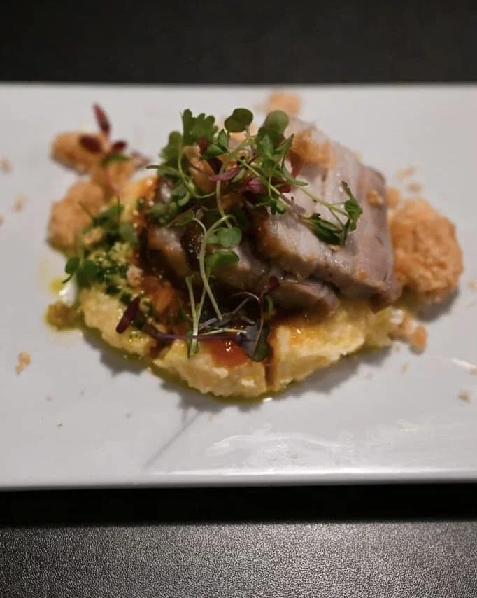 porketta, polenta, peperonata, basil oil, crispy fried pork rind