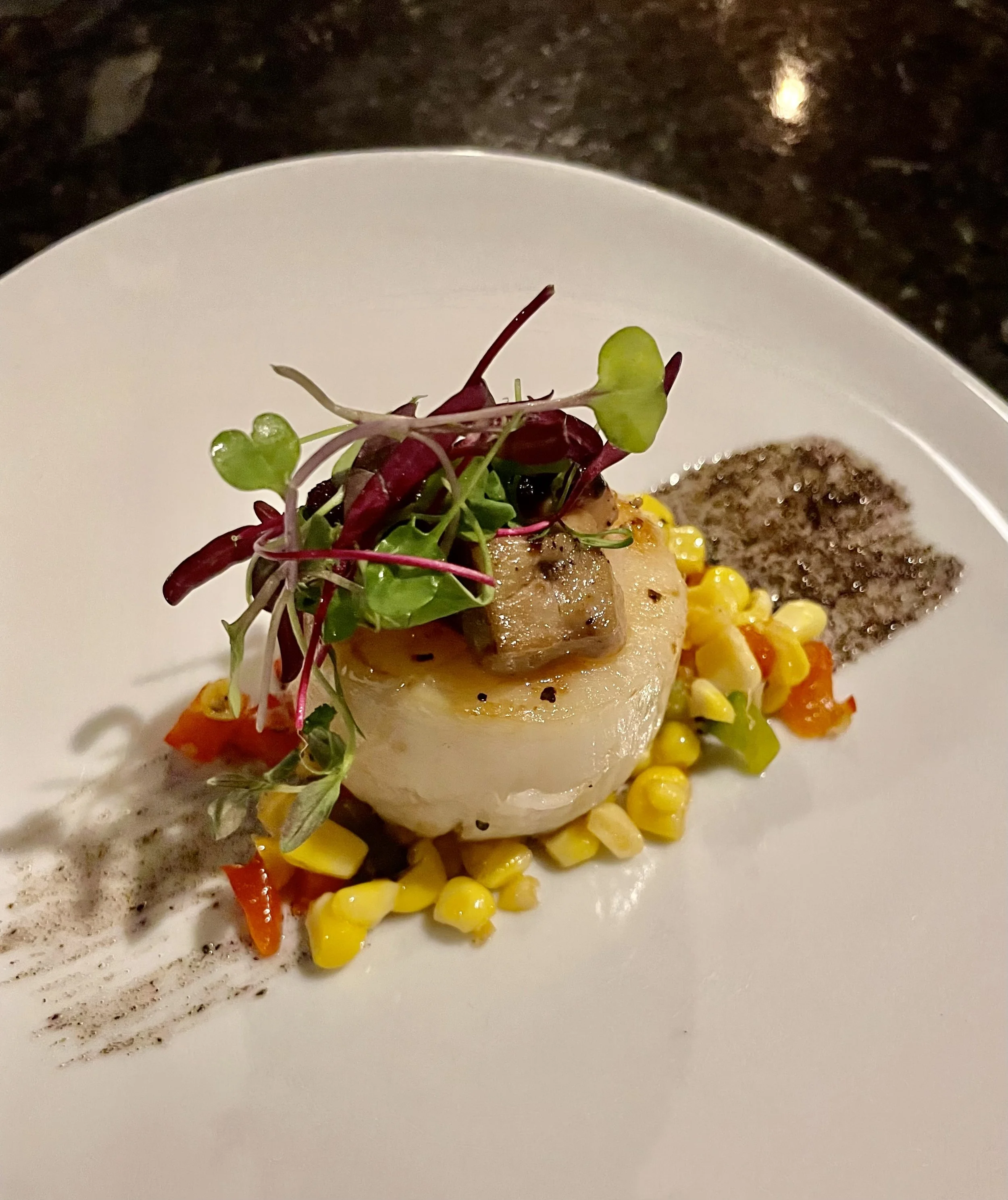 Seared Sea Scallop, charred onion on the plate, foie gras, sweet corn