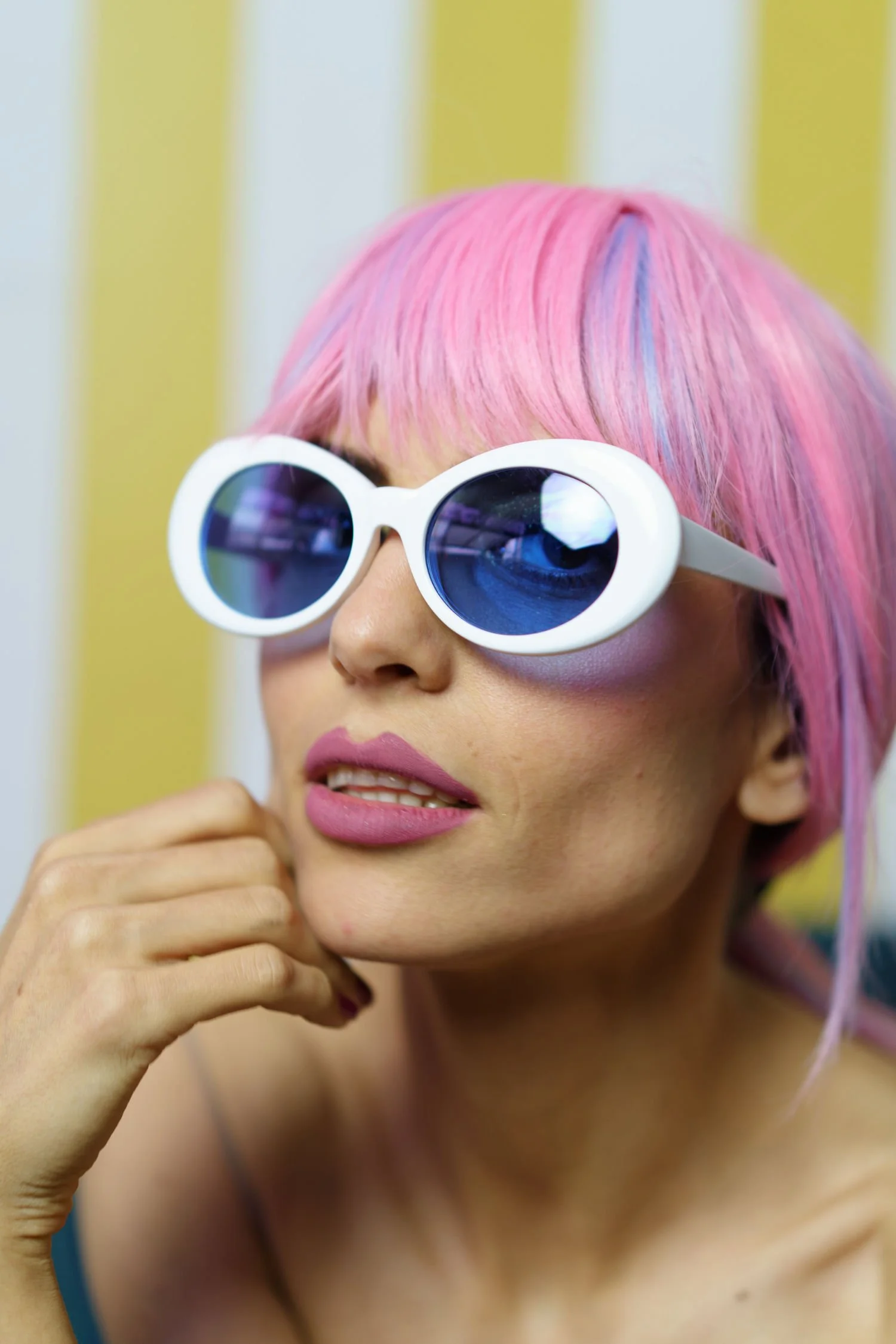 woman with pink hair and retro white glasses.jpg