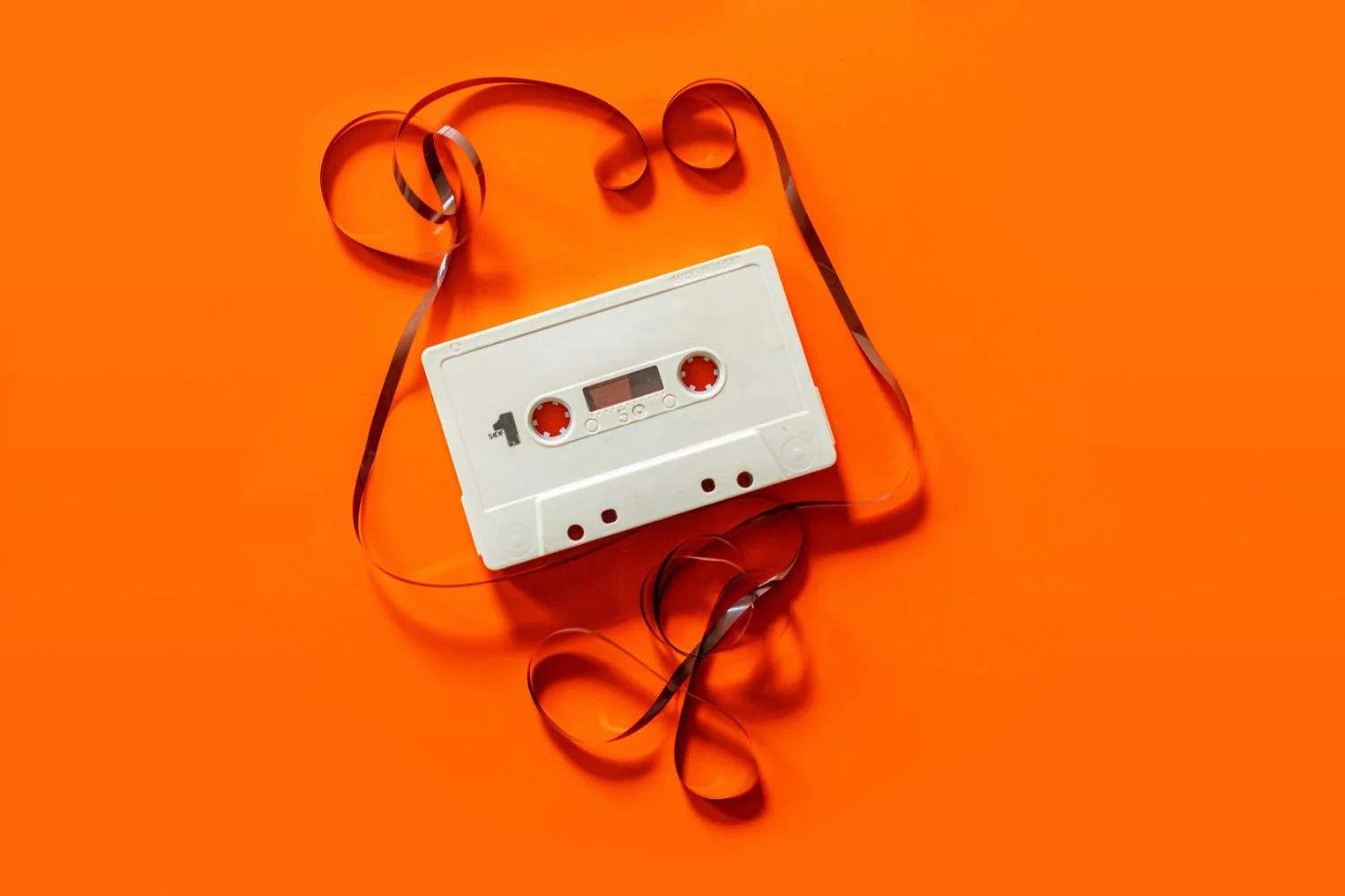 white cassette tape on orange background.jpg