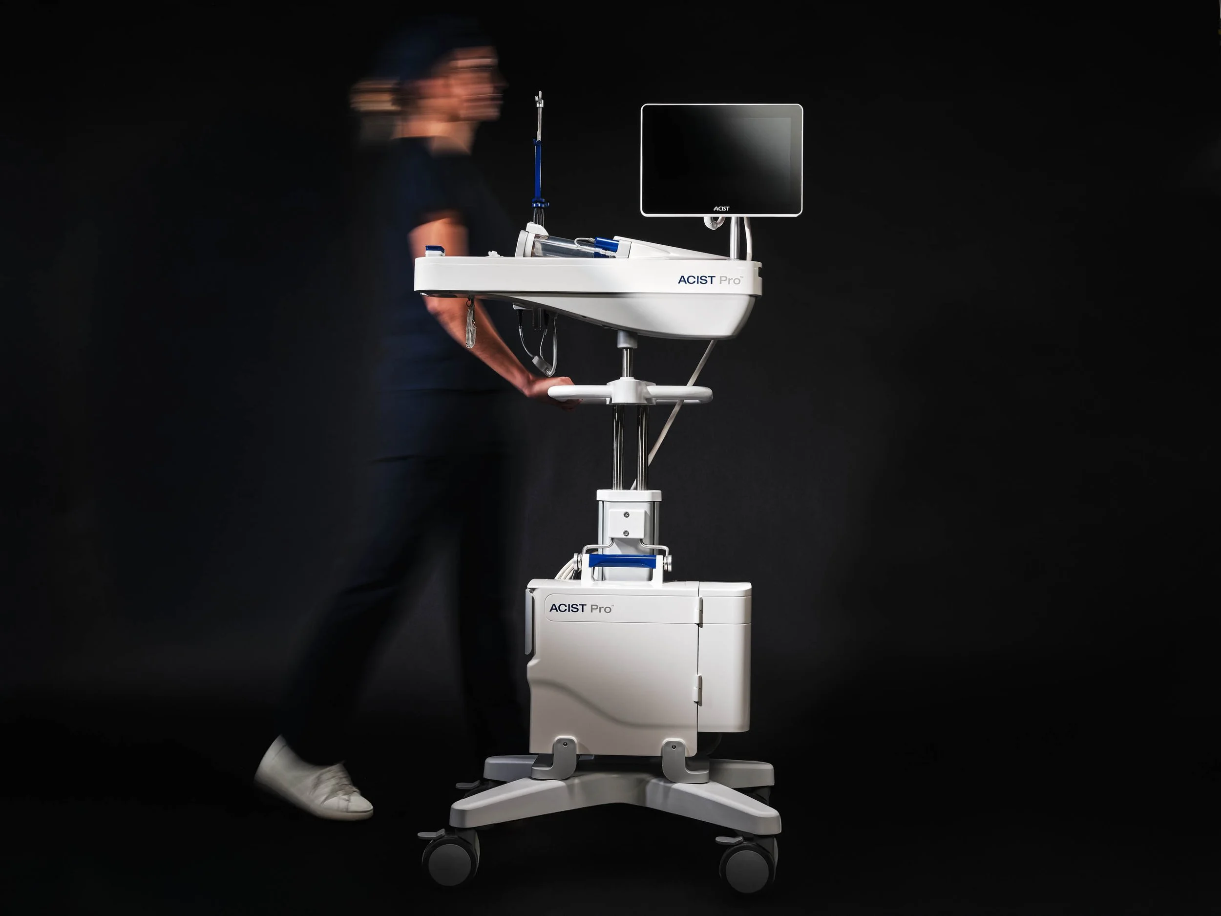 Acsist_Retouched_ACIST-Pro_hero_cart-pushed-by-nurse_Shot15_0481_altmotion 1.jpg