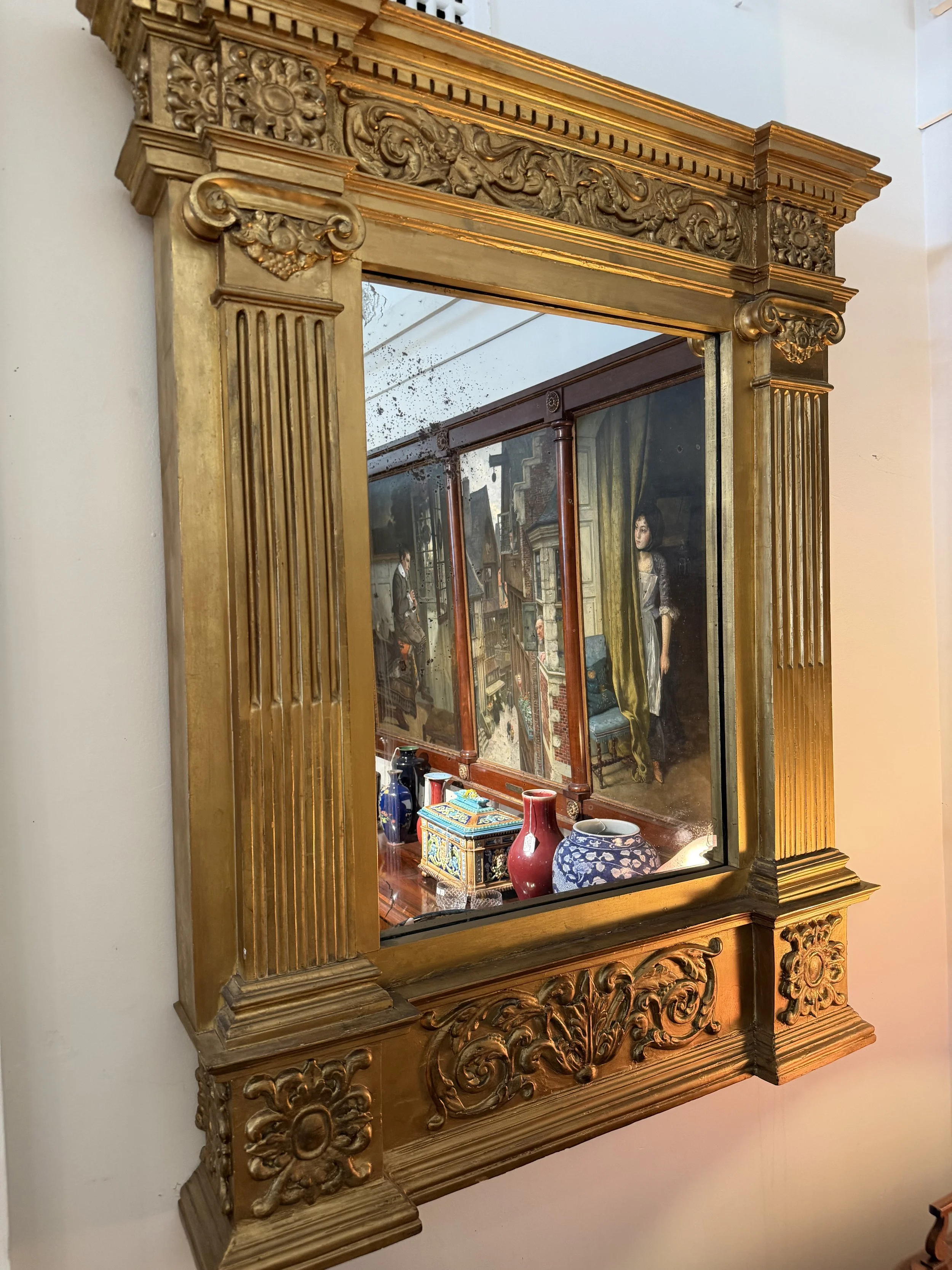 This is a picture of a very architectural early 19th century Florentine gilt wood tabernacle mirror c1800.