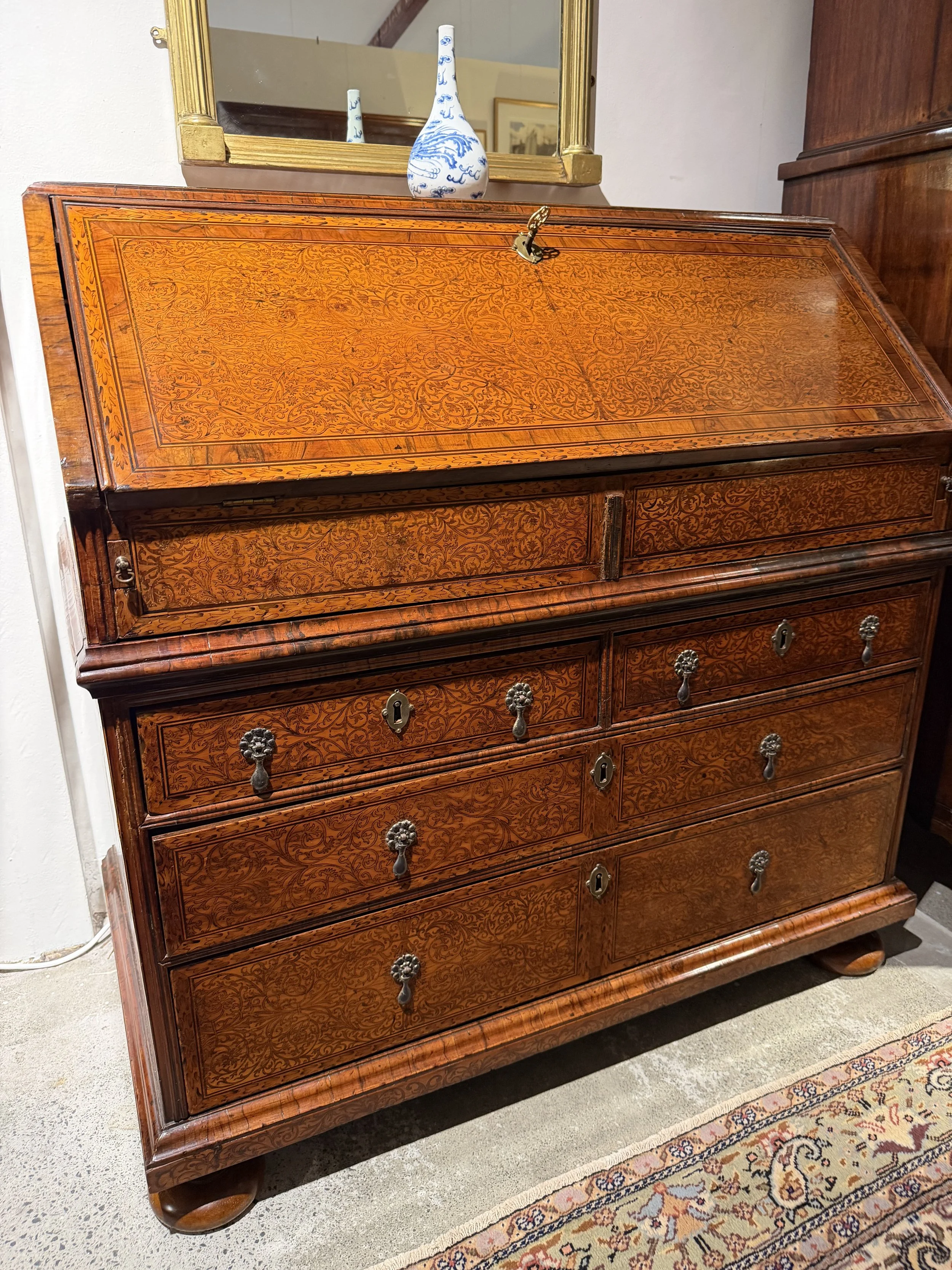 This is a picture of a very finely inlaid William & Mary period ’seaweed marquetry’ bureau c1700 attributed to Gerrit Jensen.