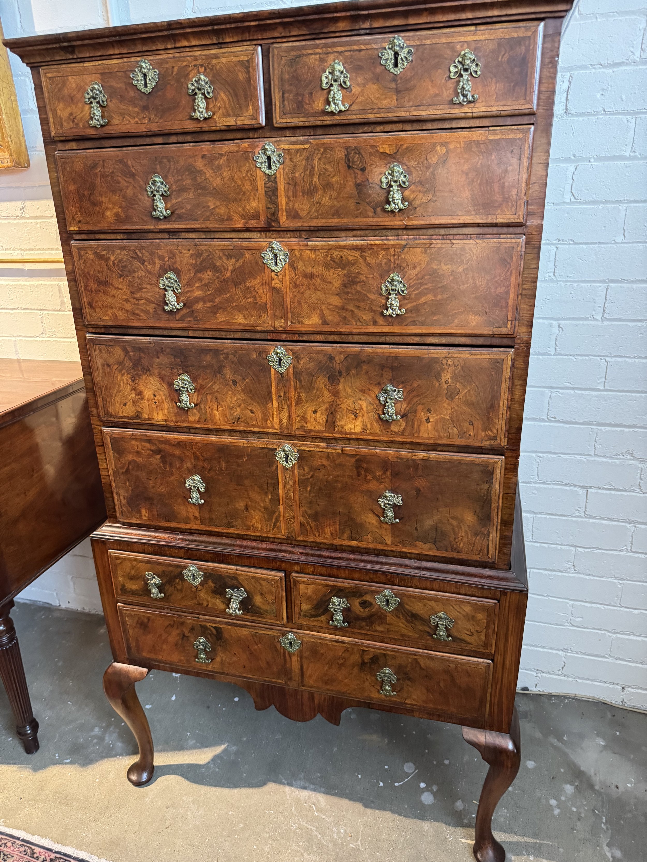 This is a picture of an antique English George II period figured walnut chest on stand c1740.