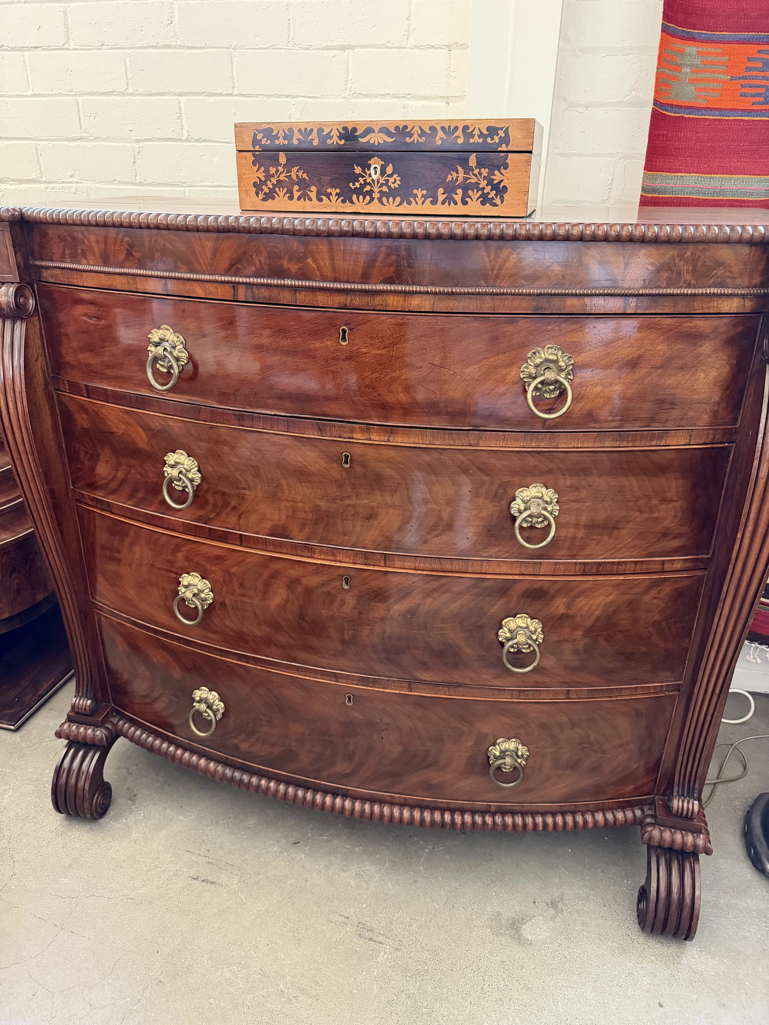 This is a picture of a superb George IV period mahogany bow front chest of drawers retaining it’s original brass ring handles, Channel Islands origin, c1825.
