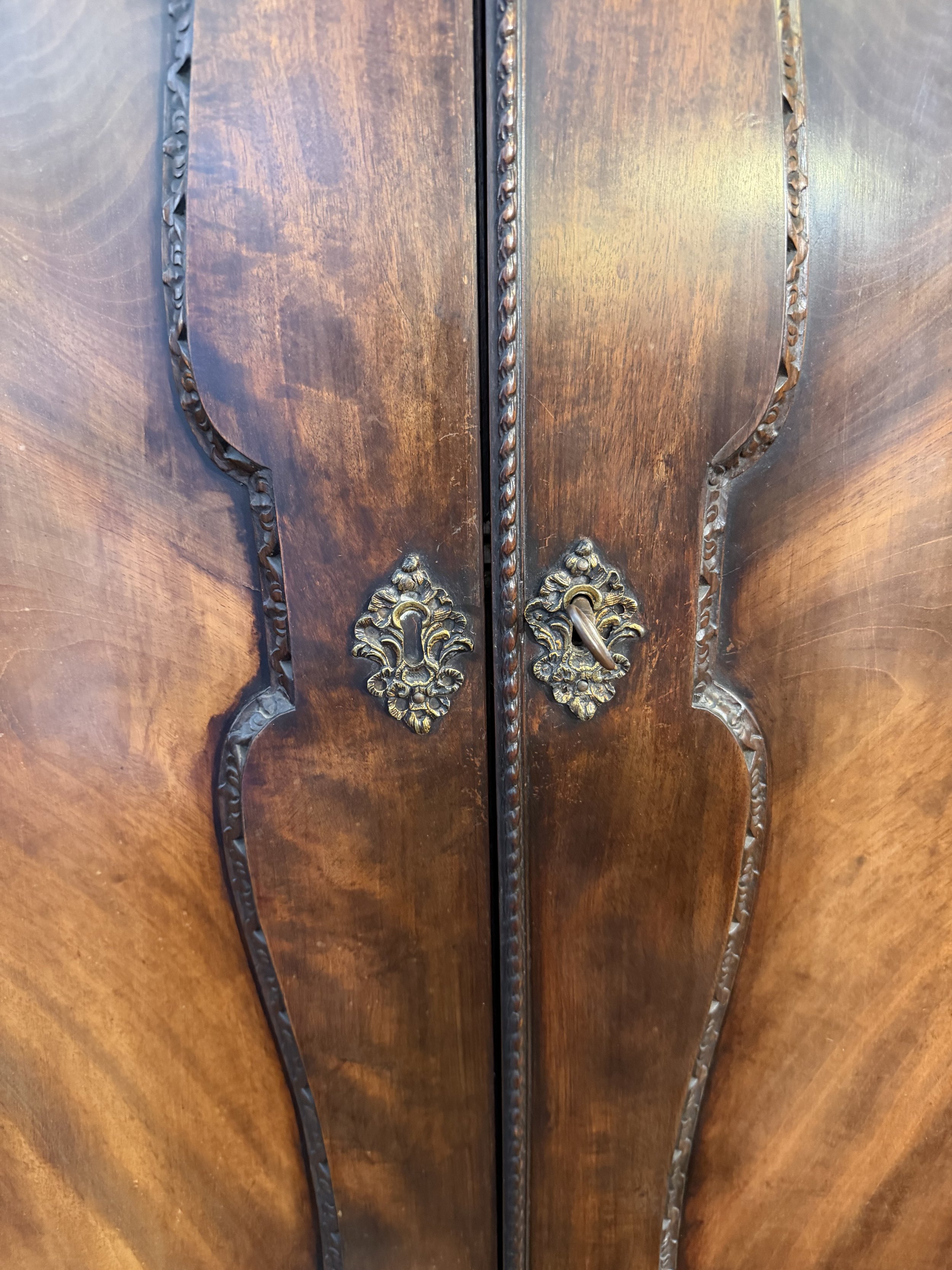This is a picture of a very handsome George II period Cuban mahogany dwarf wardrobe with its original metalware in the manner of Giles Grendey c1750.