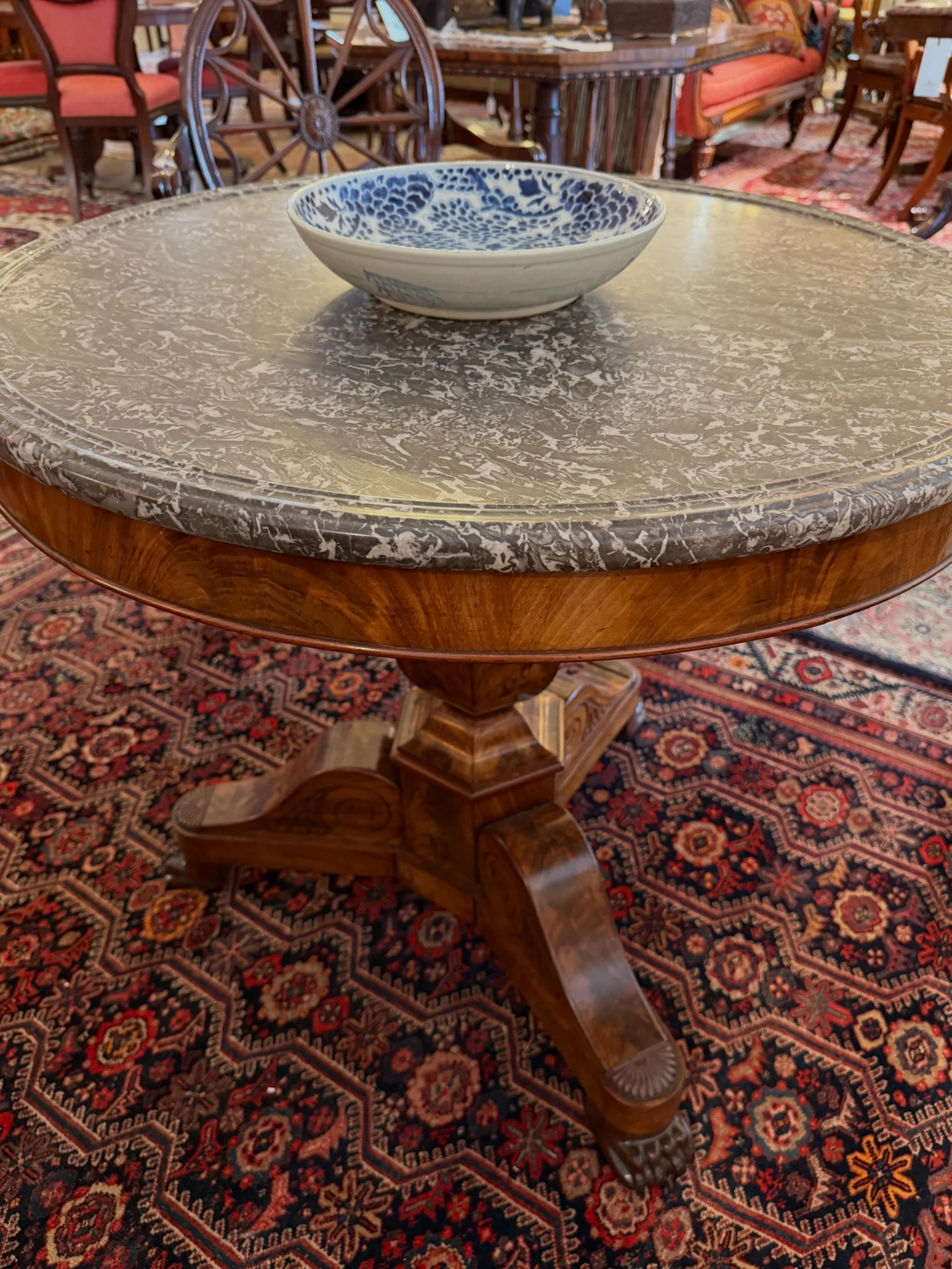 This is a picture of a fabulous and finely carved antique Louis Philippe period French mahogany and marbled topped guéridon c1830.