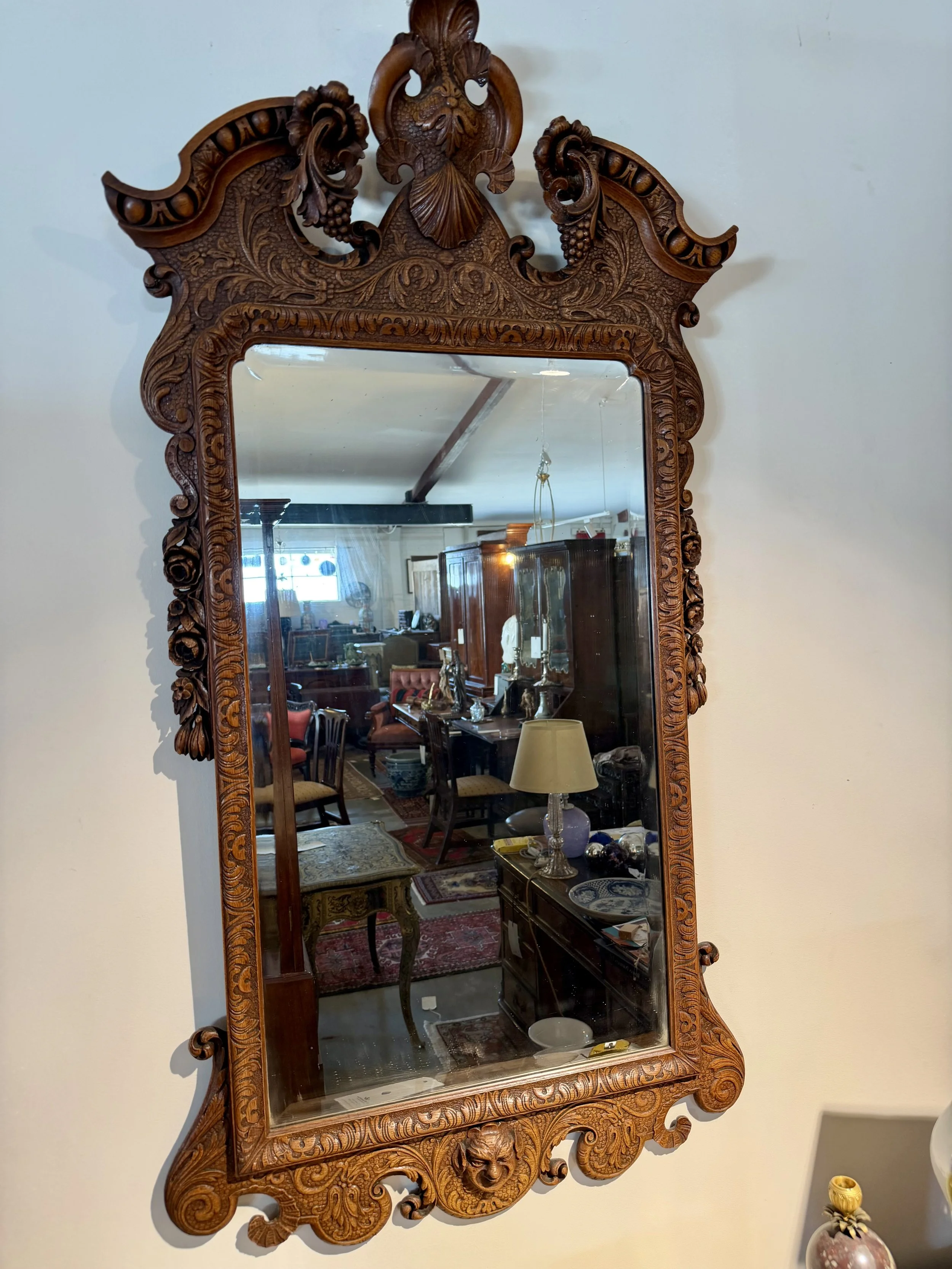 This is a picture of a very stylish late 19th century carved oak Georgian revival mirror.