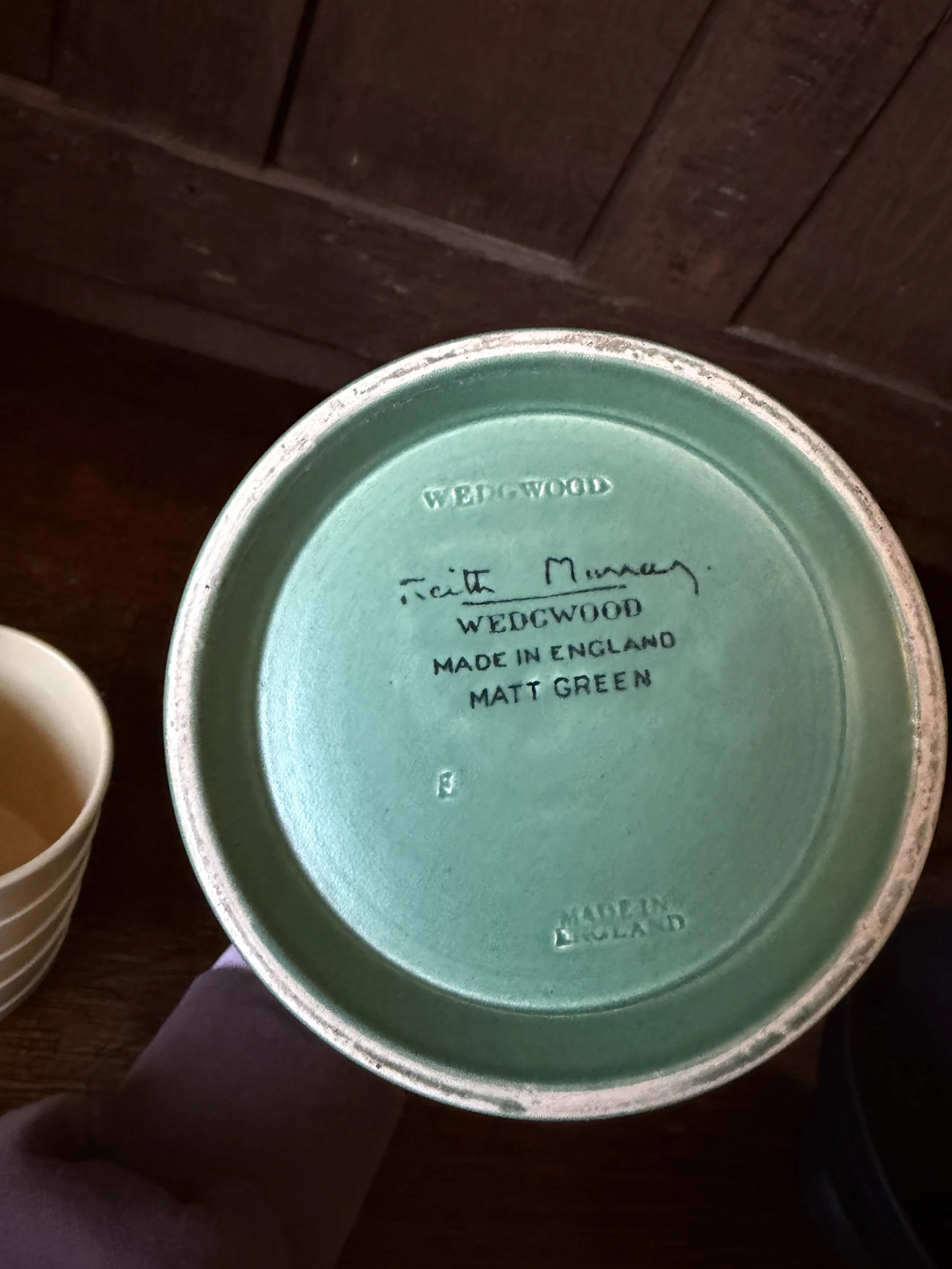 This is a picture of a Keith Murray for Wedgwood Art Deco green coloured vase c1930.
