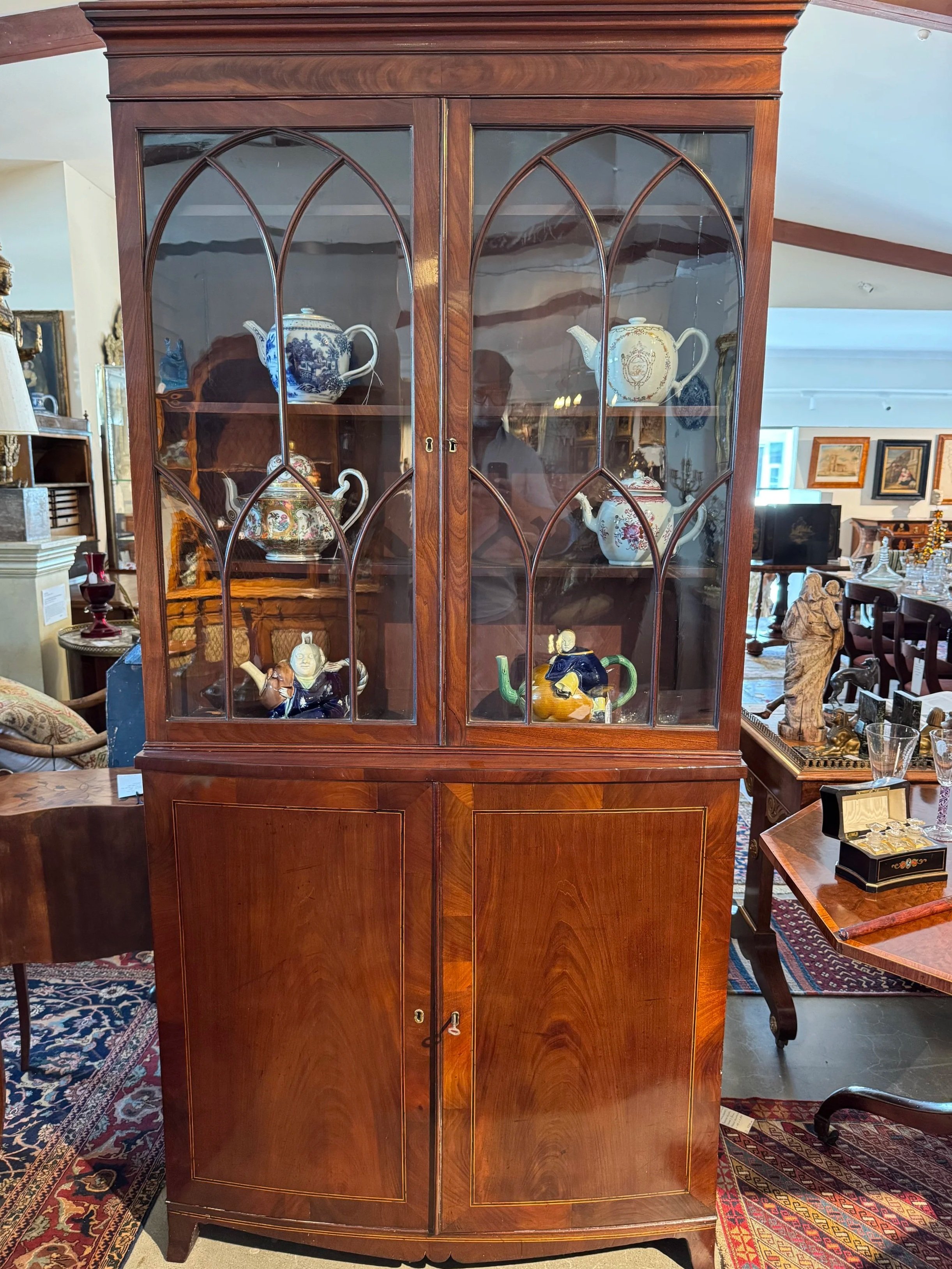 This is a picture of an antique Regency period mahogany bookcase of unusually slim proportions c1810.