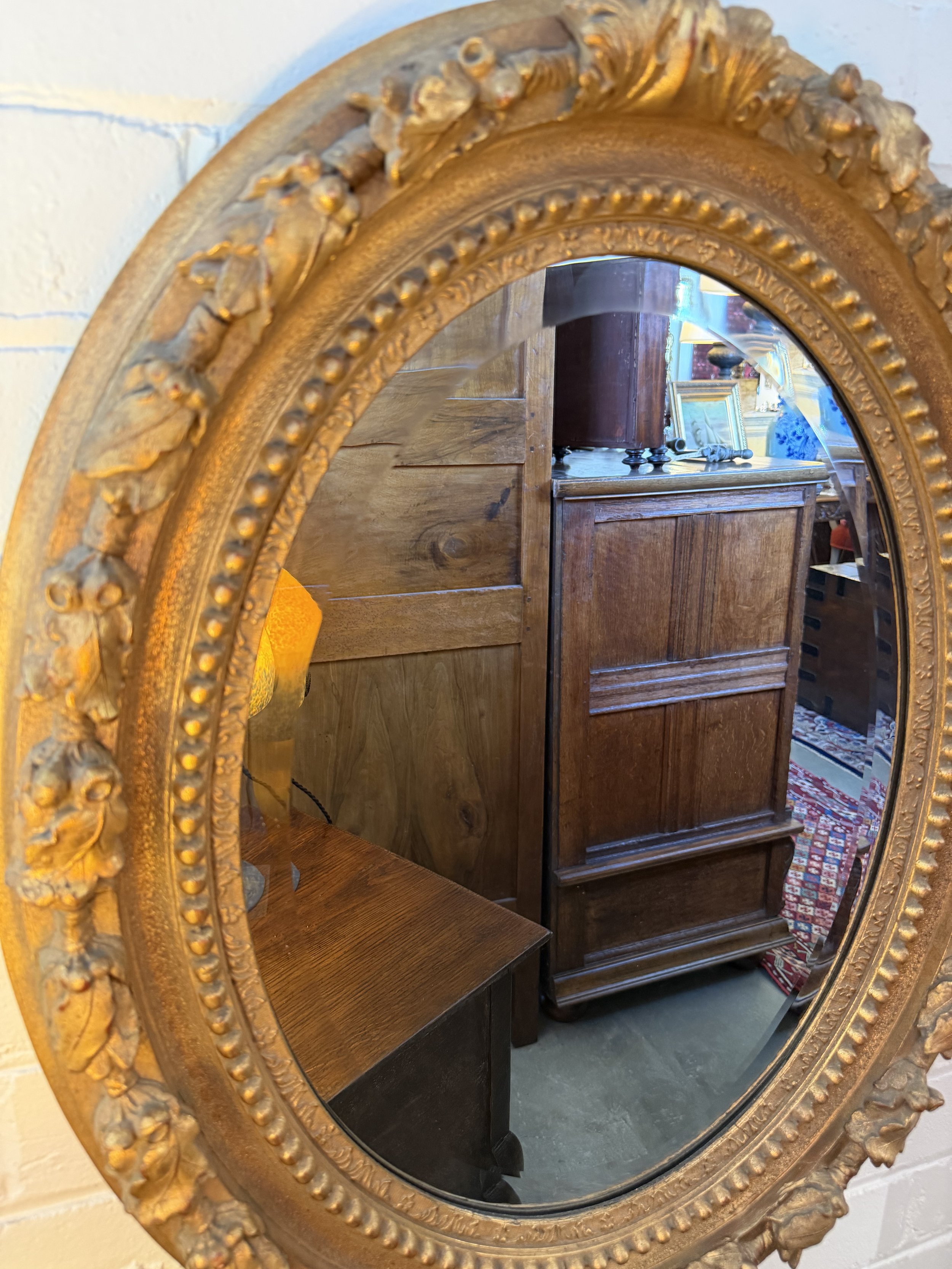 This is a picture of a French Napoleon III period acorn decorated gilt mirror c1860.