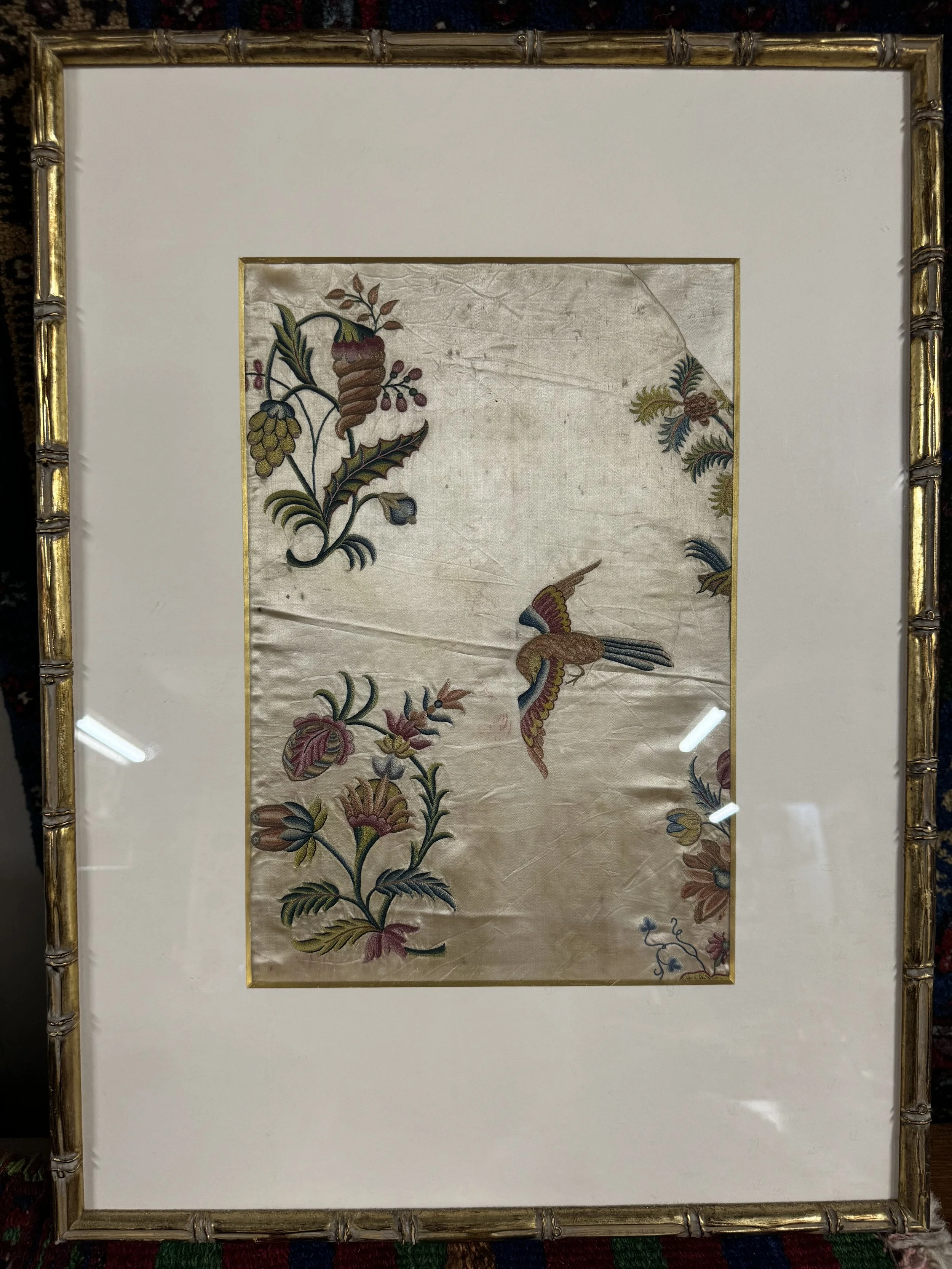 This is a picture of a very finely worked piece of framed late 18th century Chinese silk embroidery.