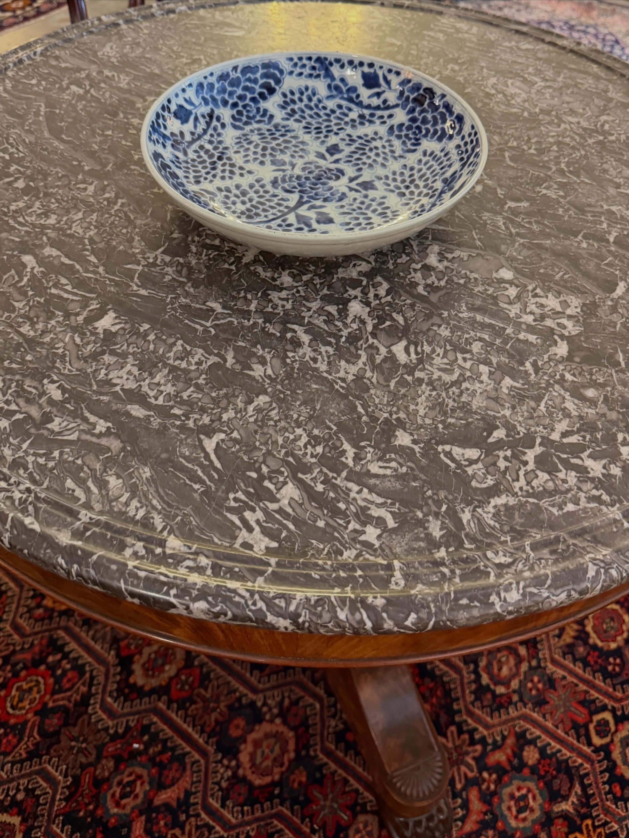 This is a picture of a fabulous and finely carved antique Louis Philippe period French mahogany and marbled topped guéridon c1830.