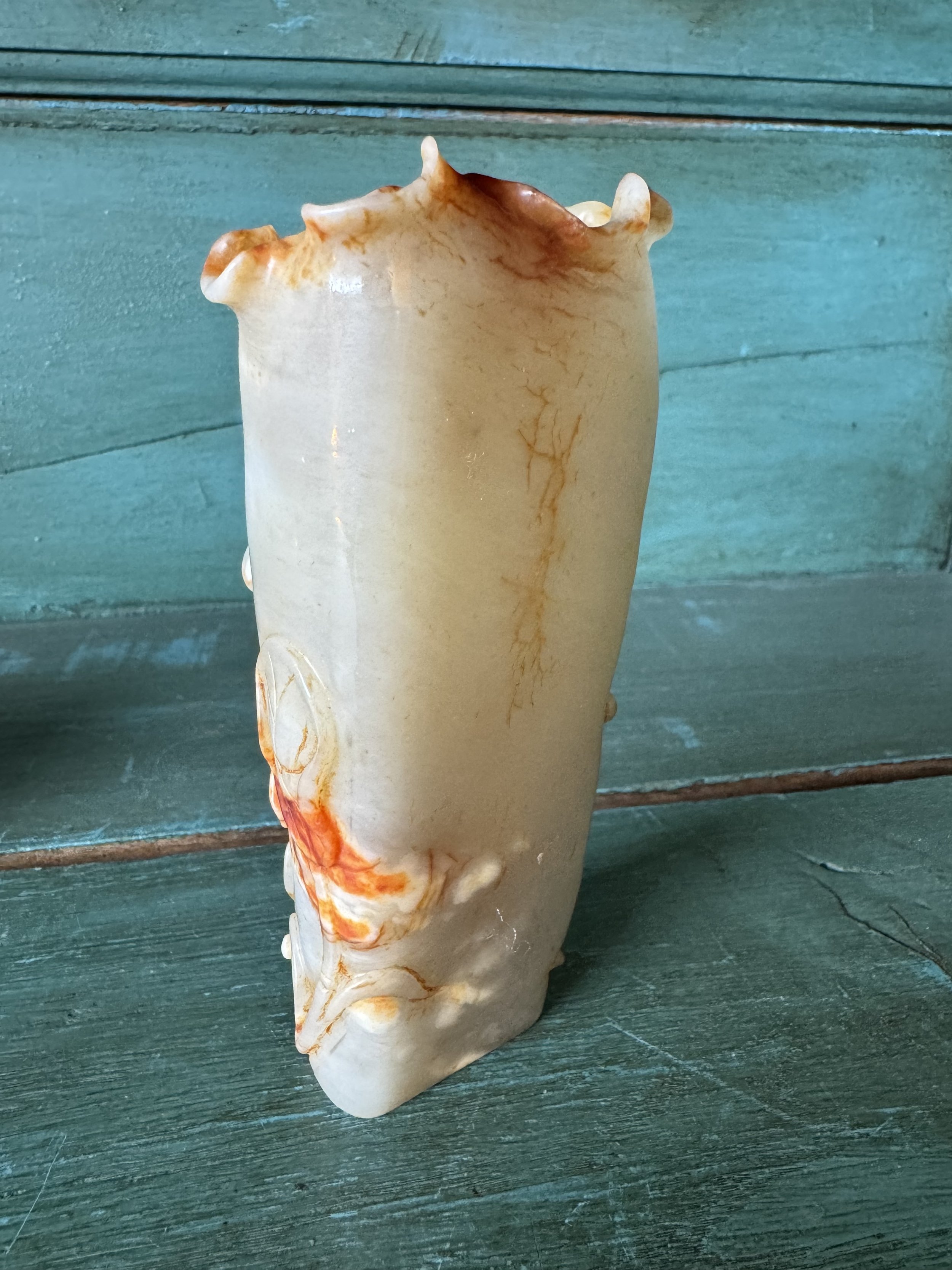 This is a picture of a very beautiful and finely carved antique 19th century Chinese jade brush washer.