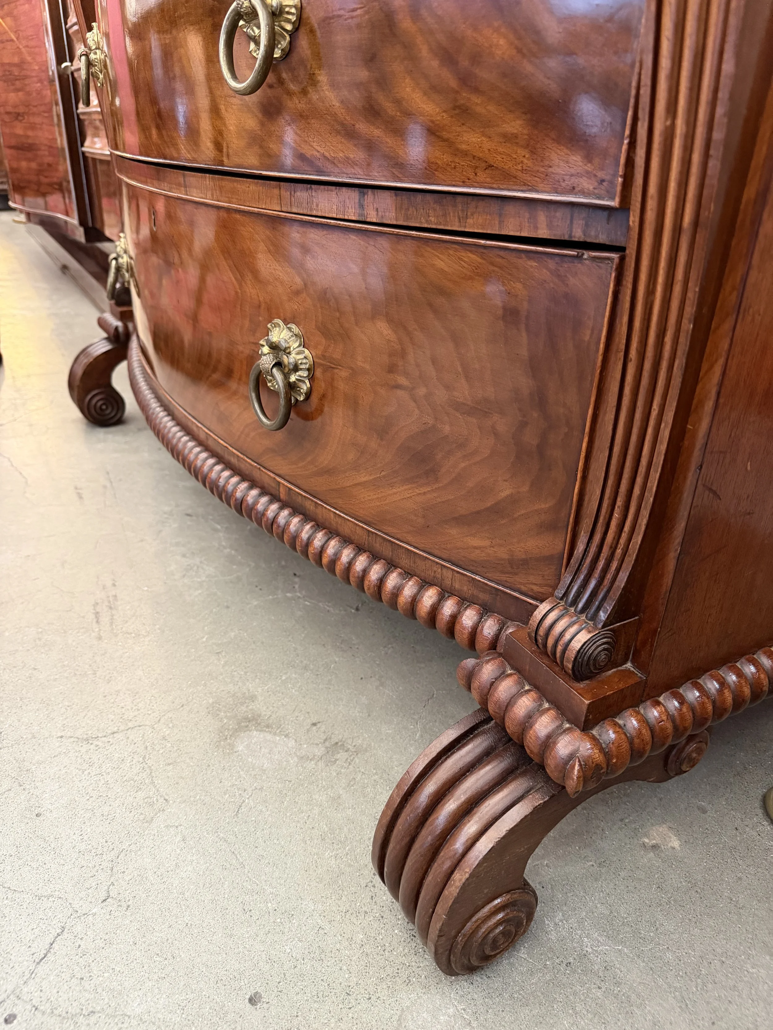 This is a picture of a superb George IV period mahogany bow front chest of drawers retaining it’s original brass ring handles, Channel Islands origin, c1825.
