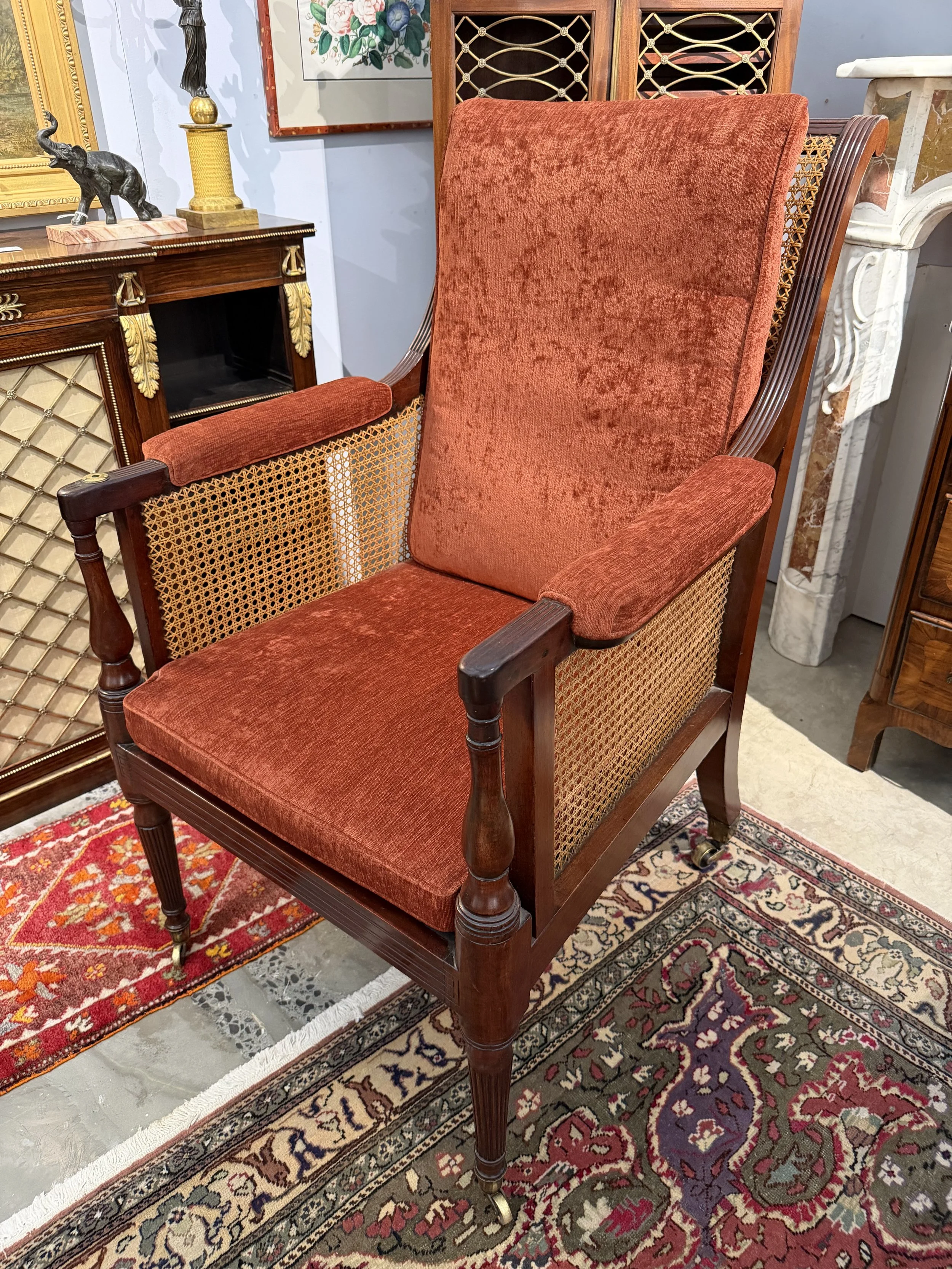 This is a picture of a very comfortable caned mahogany Georgian library armchair c1800.