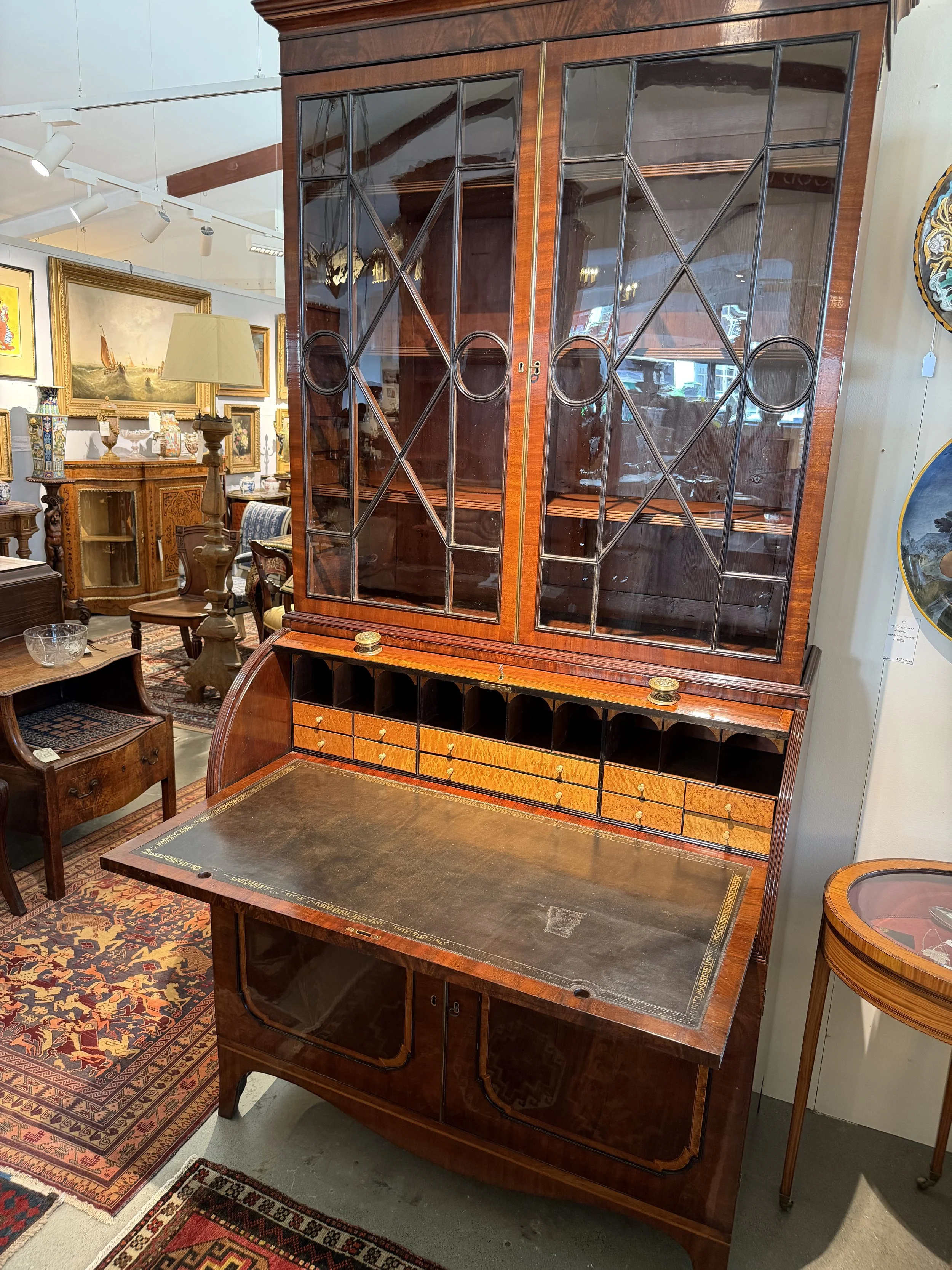 This is a picture of a fine quality satinwood cross banded mahogany cylinder bookcase c1810.