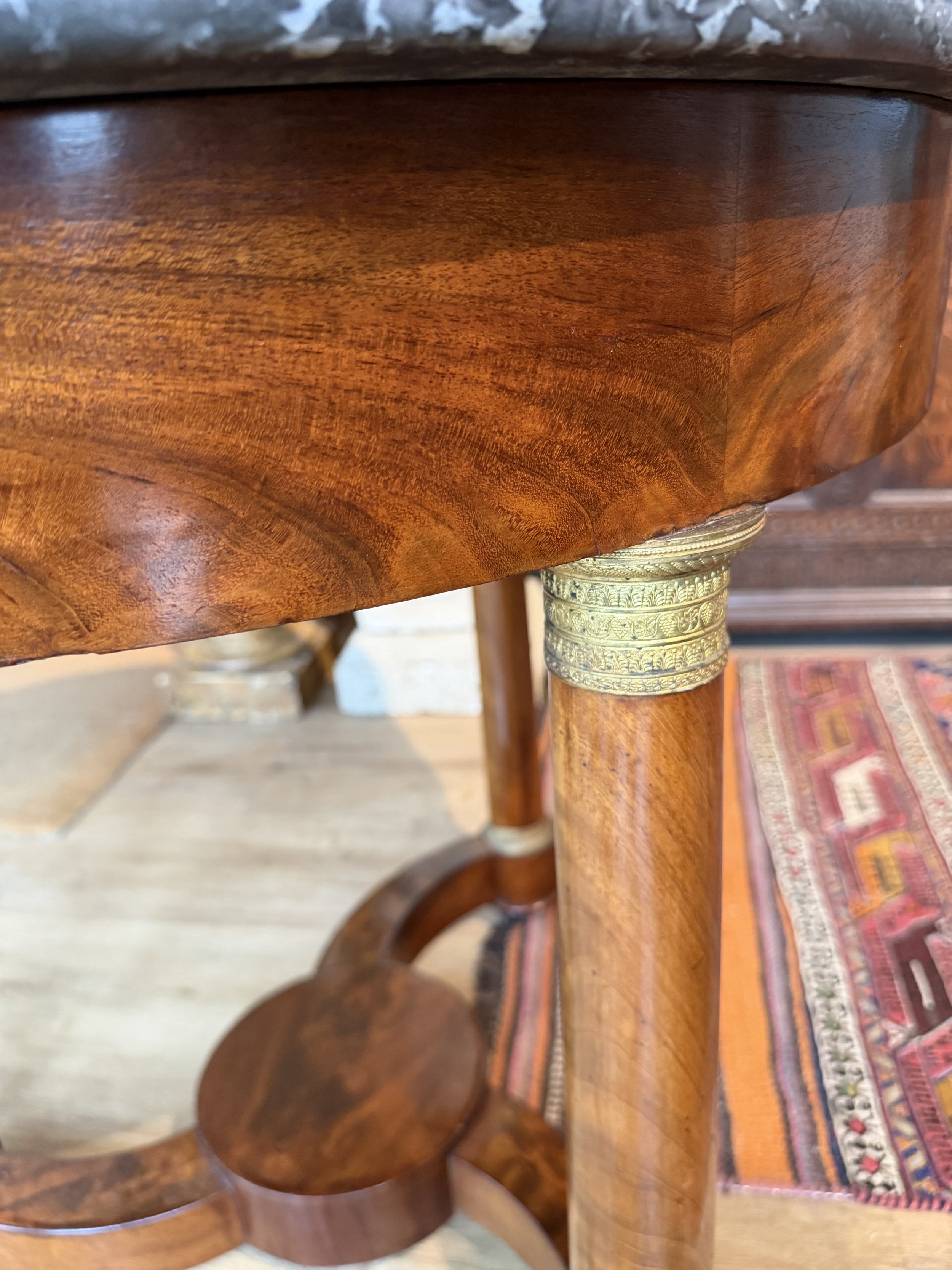 This is a picture of a very elegant French Empire ormolu mounted mahogany marble topped guéridon c1820.