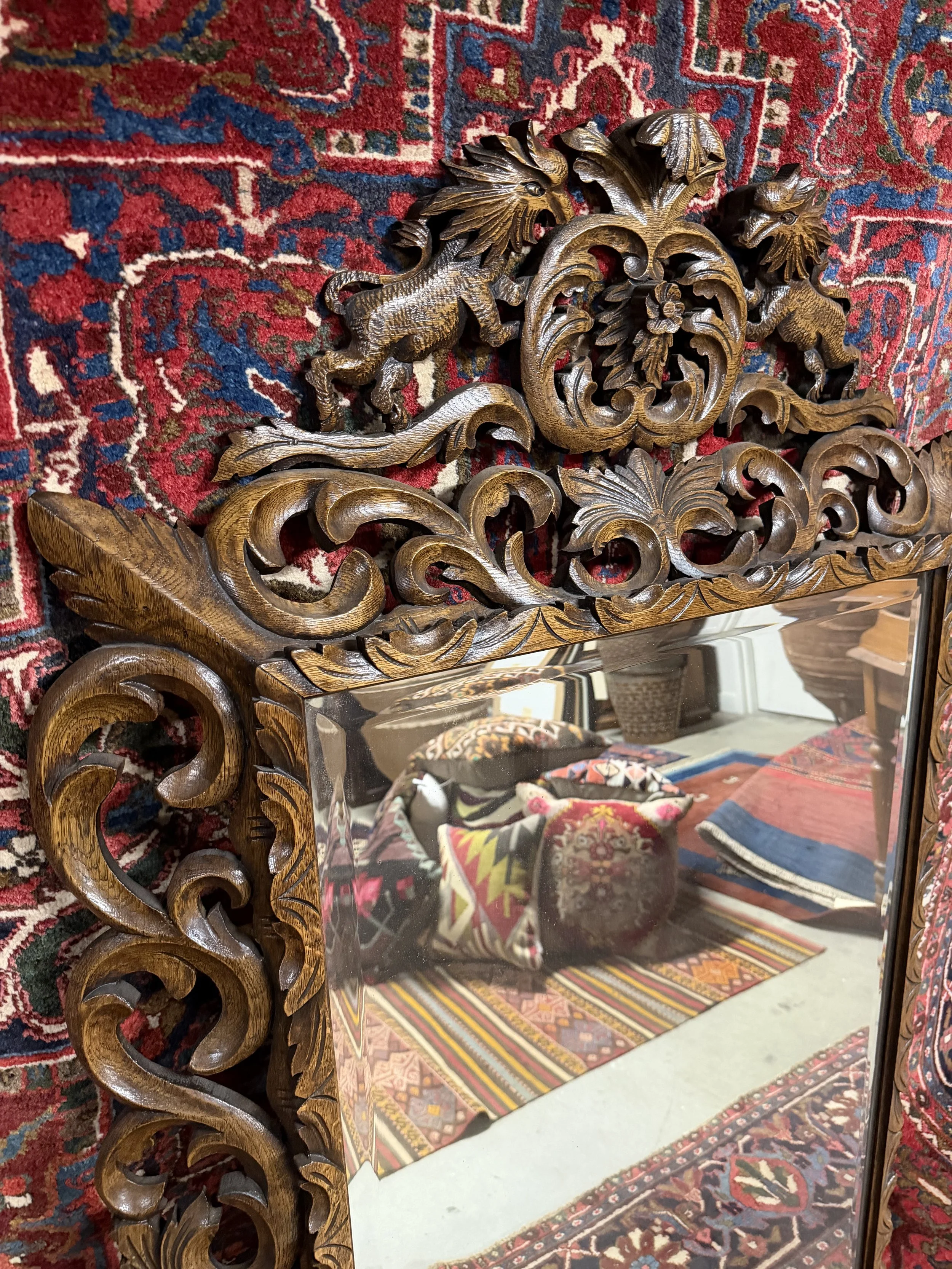 This is a picture of a fabulously carved late 19th century French oak mirror.