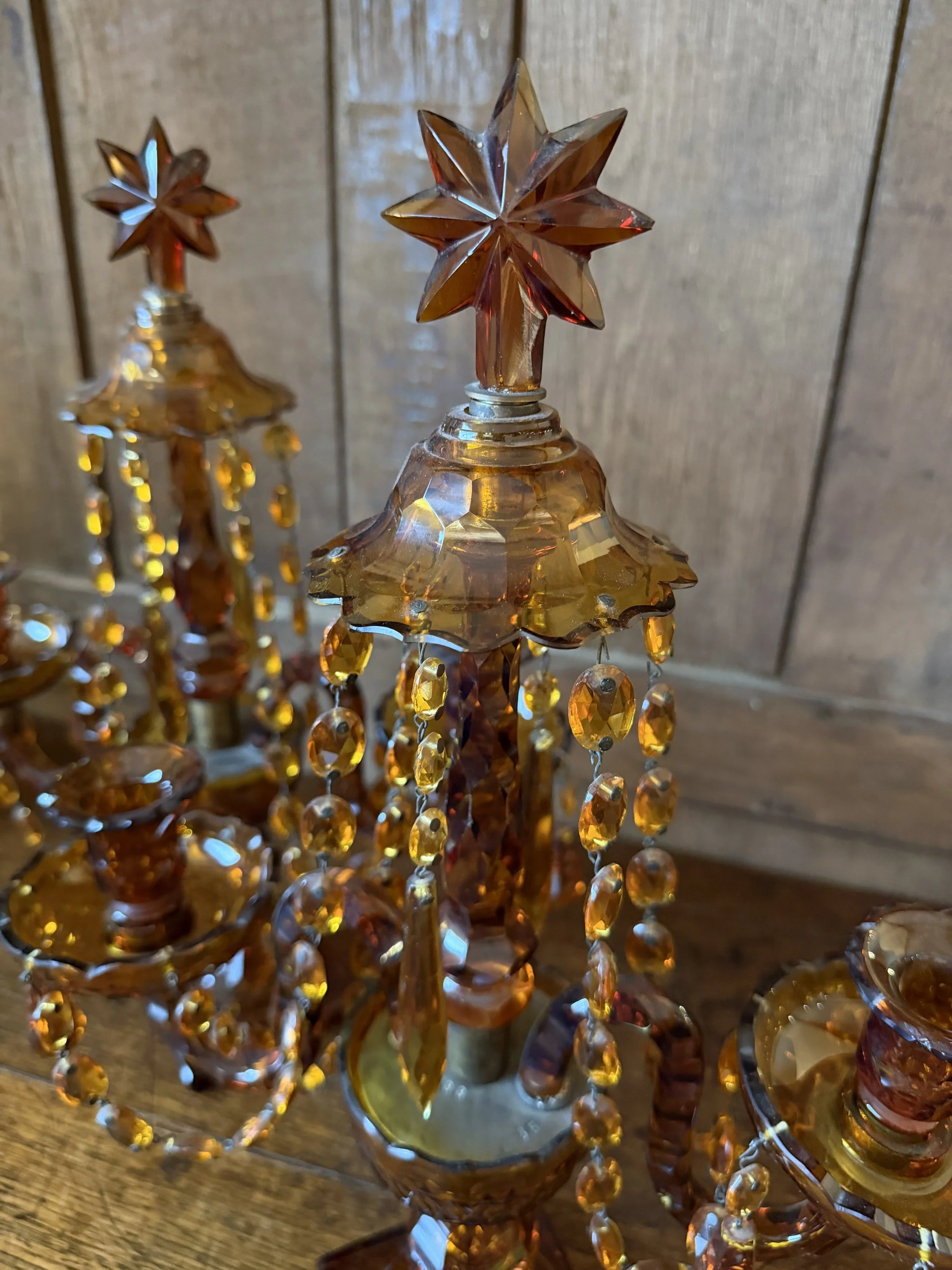 This is a picture of a fabulous pair of Edwardian Georgian revival girandoles in amber glass c1900.