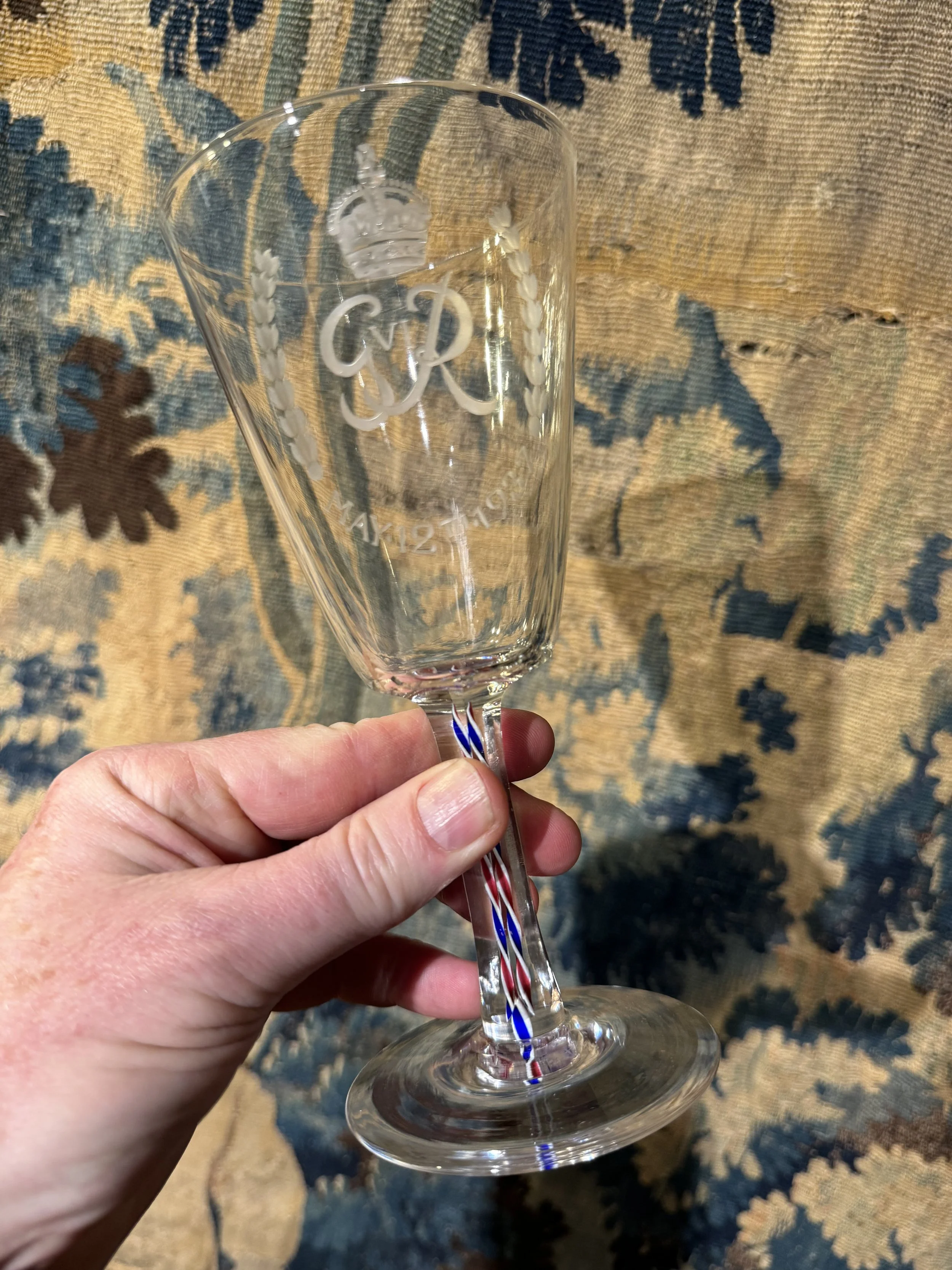 This is a picture of a fine and rare George VI Webb & Co engraved and enamel twist stem glass made for the 1937 coronation of King George VI, signed to the base.
