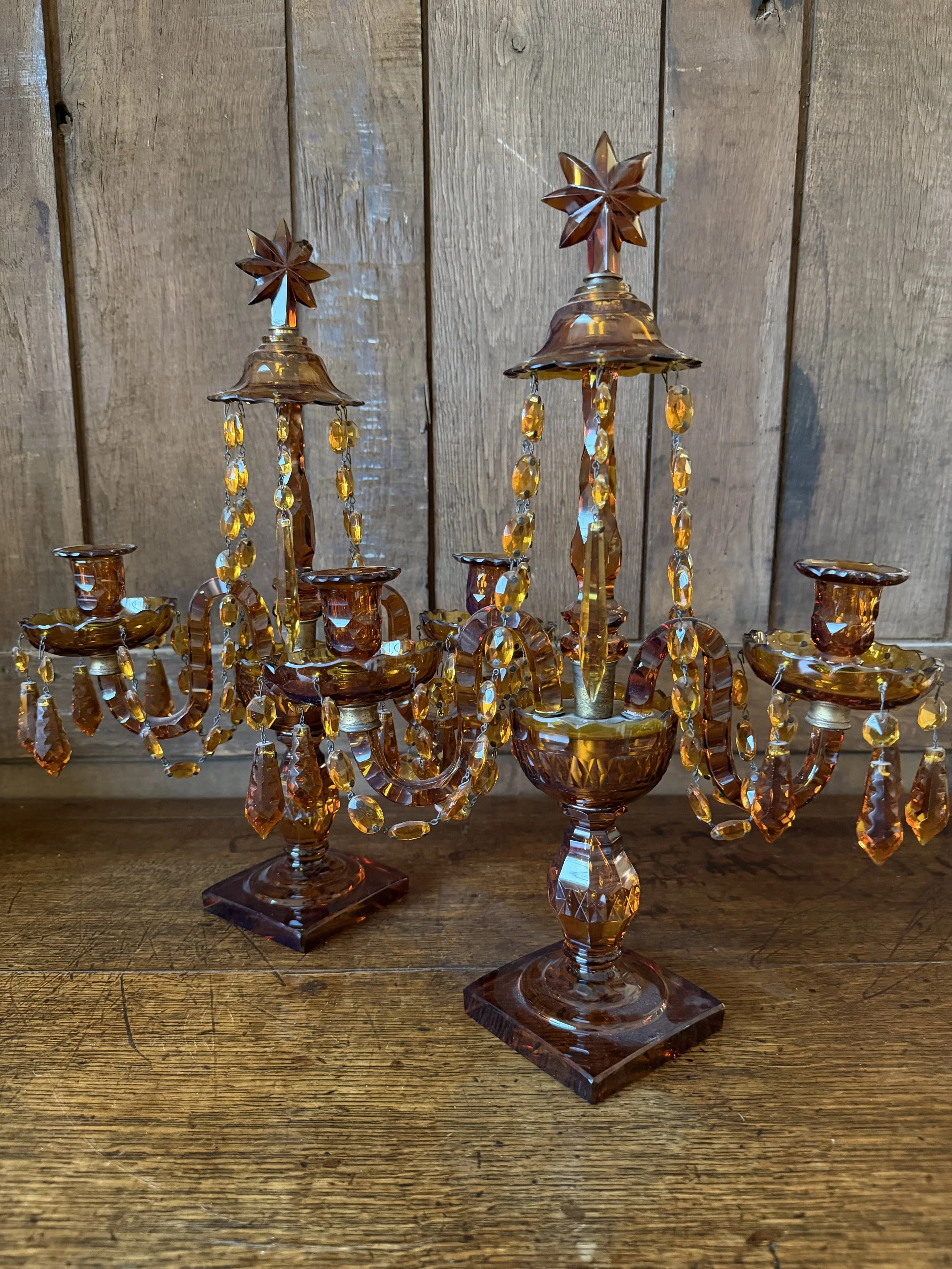 This is a picture of a fabulous pair of Edwardian Georgian revival girandoles in amber glass c1900.
