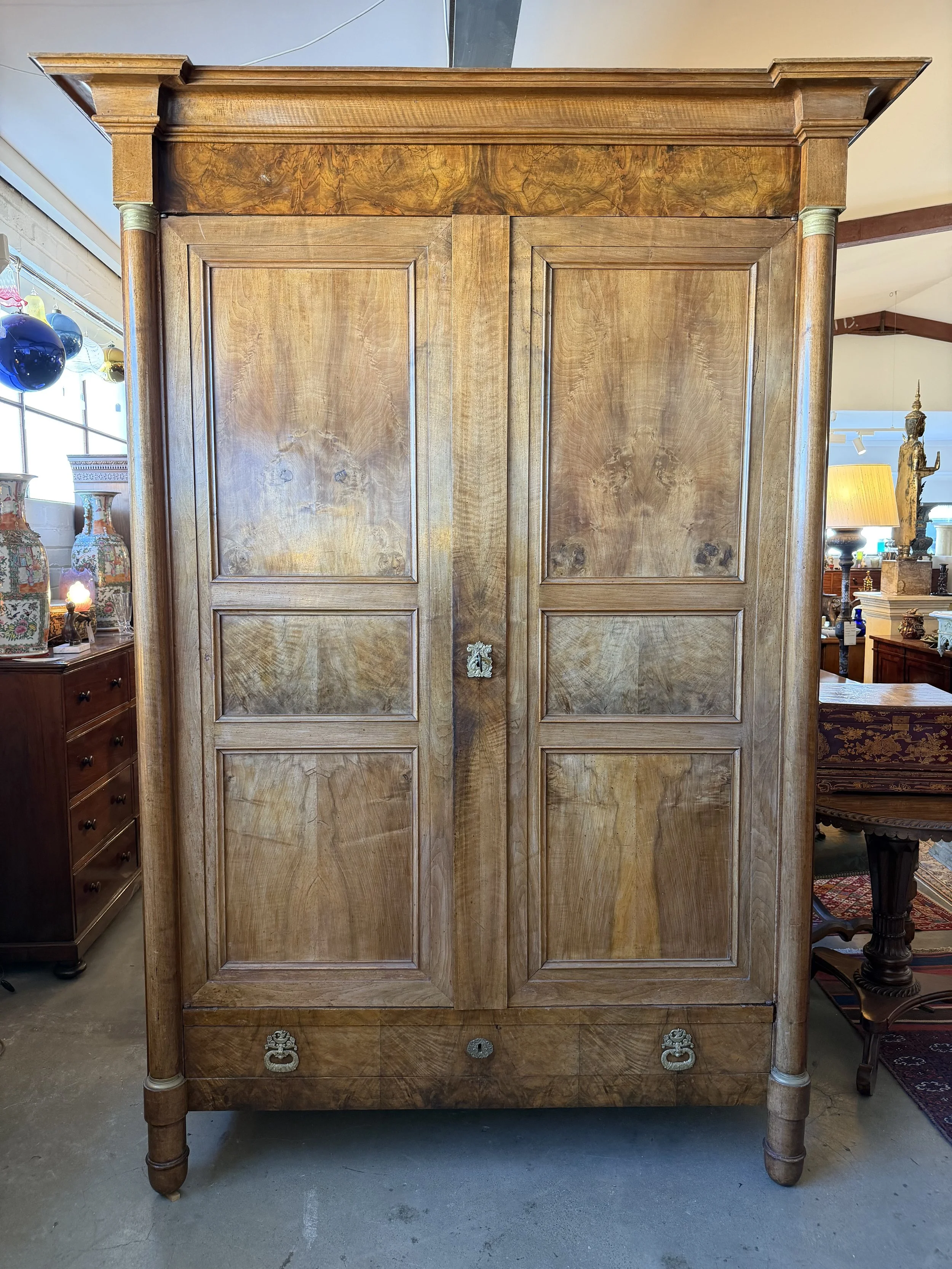 This is a picture of a fabulous French Empire walnut cupboard c1830 with the most beautiful colour and original hardware.