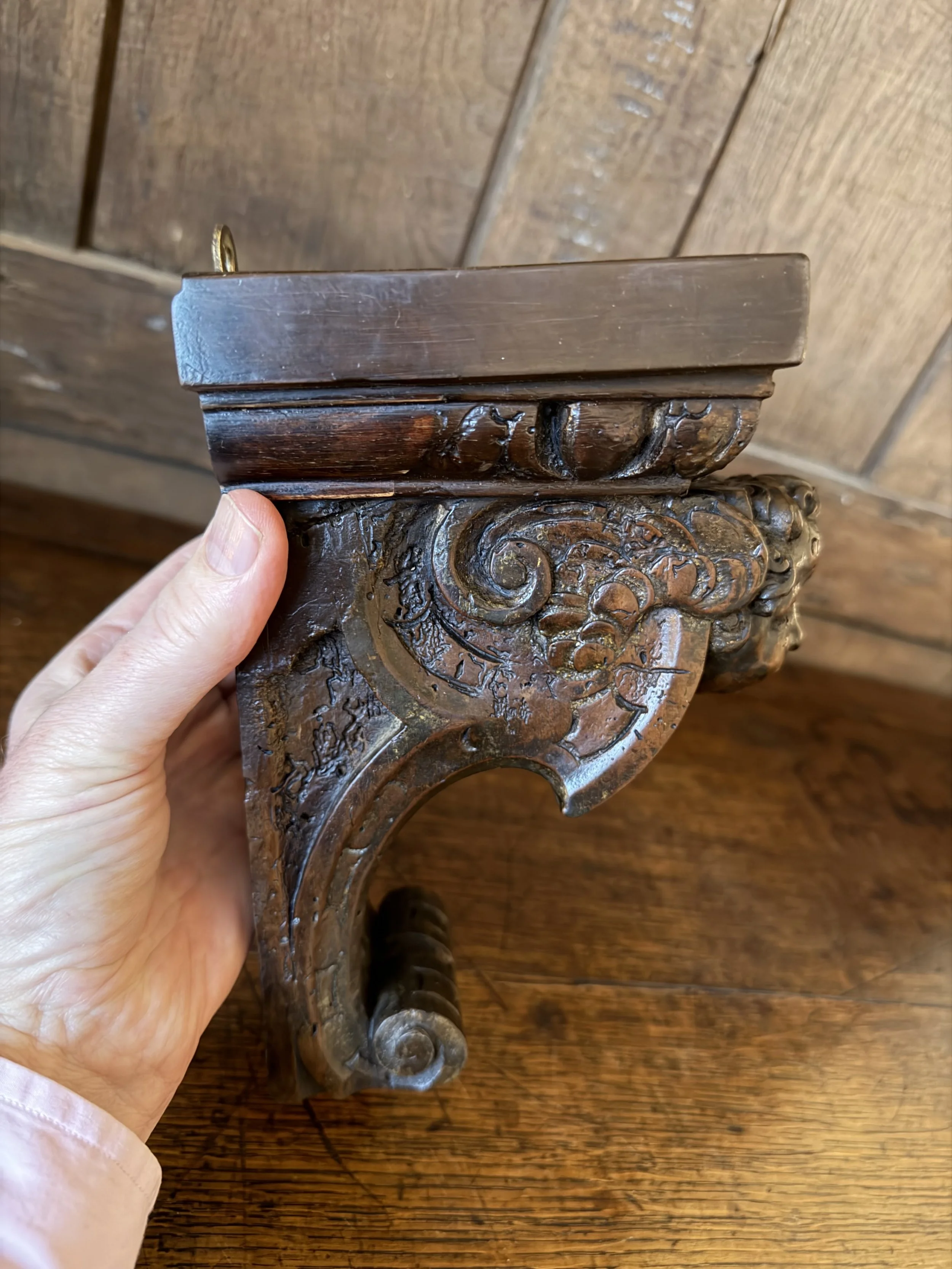 This is a picture of a 17th century Venetian carved walnut bracket in the form of a cherub.
