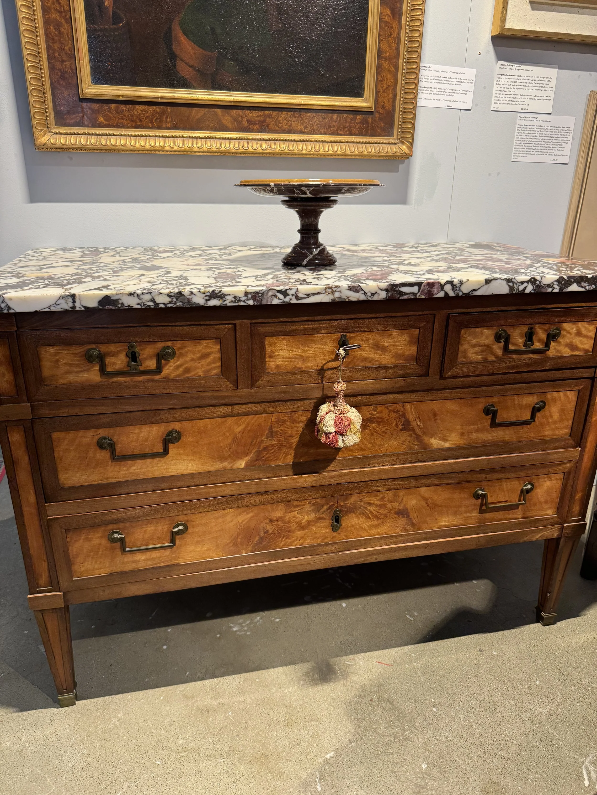 This is a picture of an antique French Louis XVI period mahogany and citronnier commode c1790.