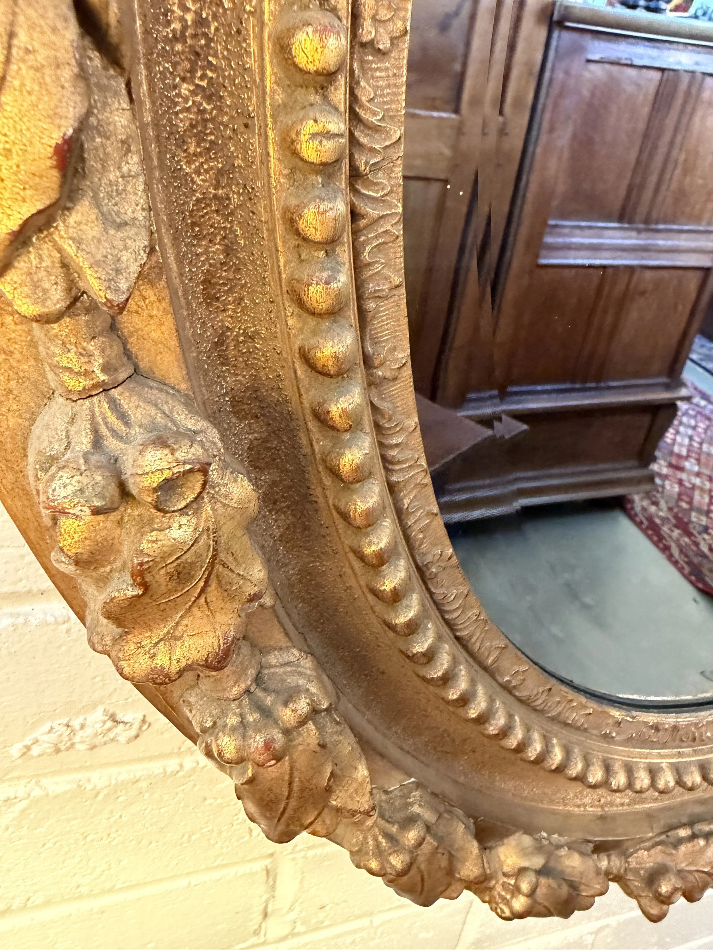 This is a picture of a French Napoleon III period acorn decorated gilt mirror c1860.