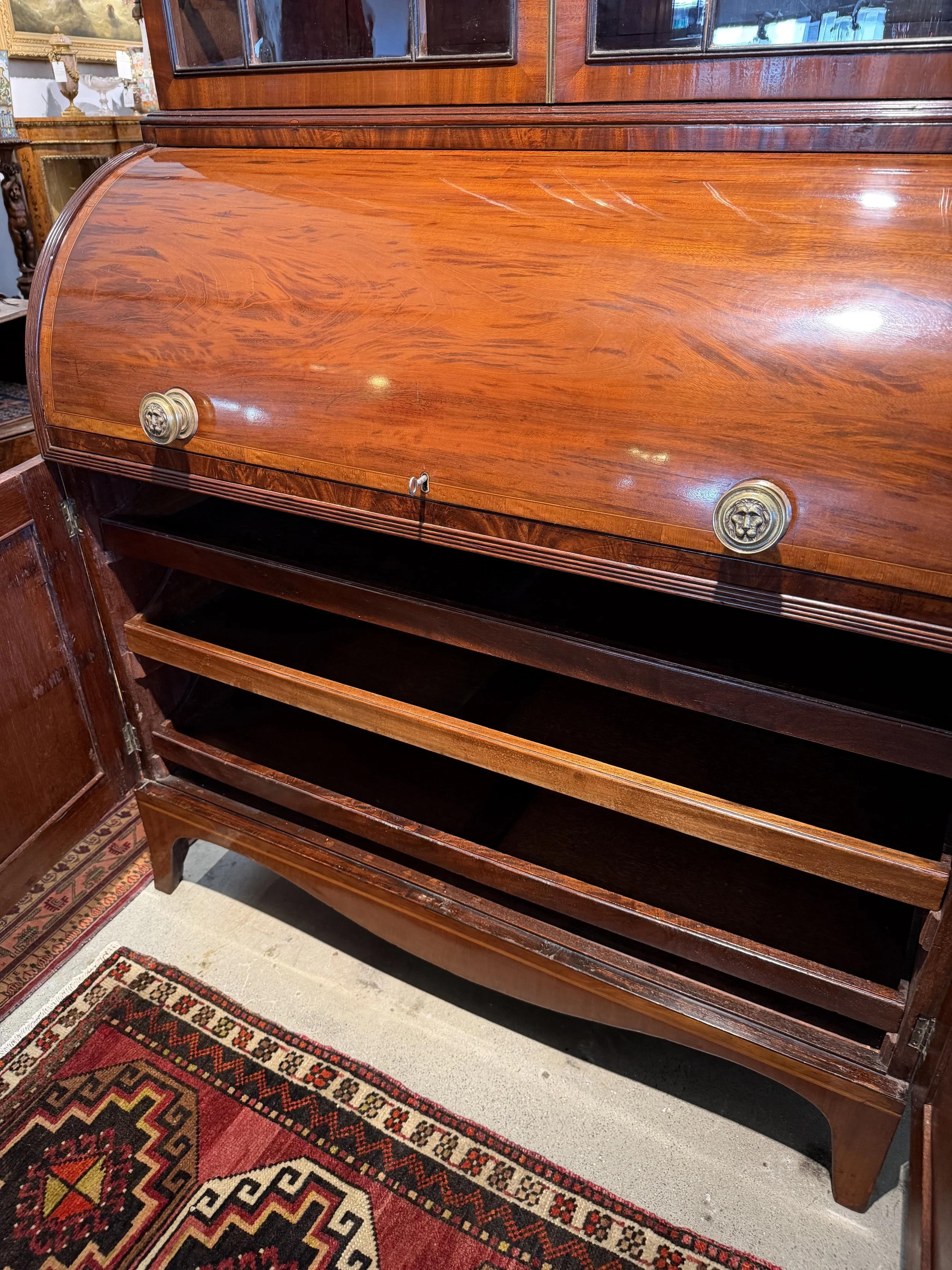 This is a picture of a fine quality satinwood cross banded mahogany cylinder bookcase c1810.
