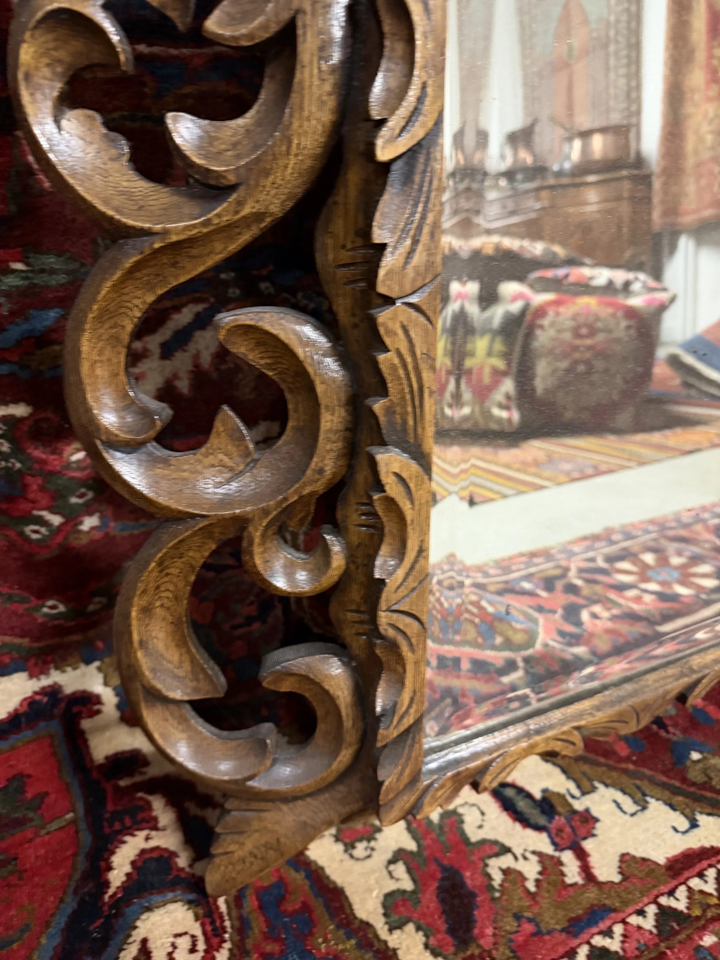 This is a picture of a fabulously carved late 19th century French oak mirror.