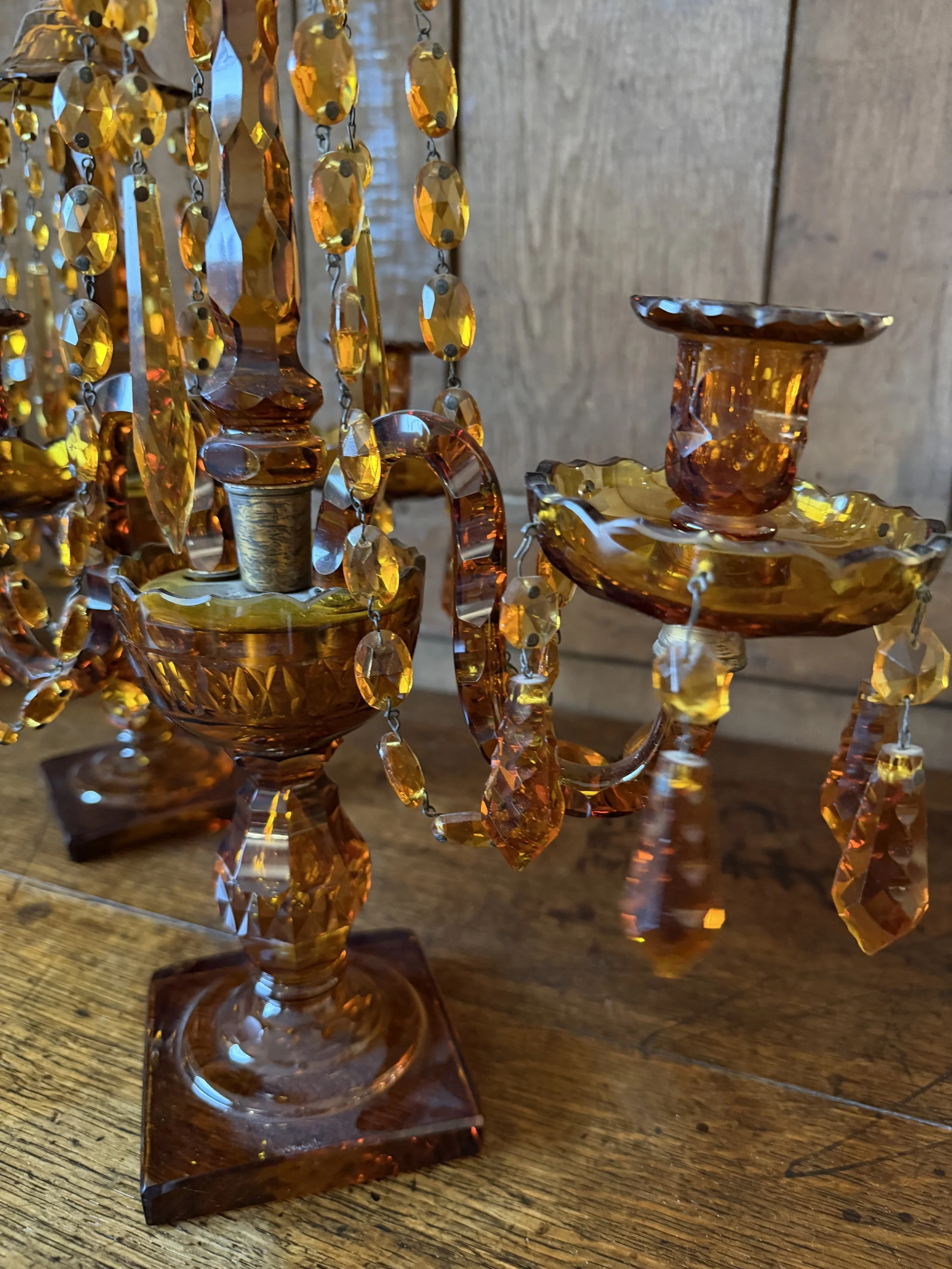 This is a picture of a fabulous pair of Edwardian Georgian revival girandoles in amber glass c1900.