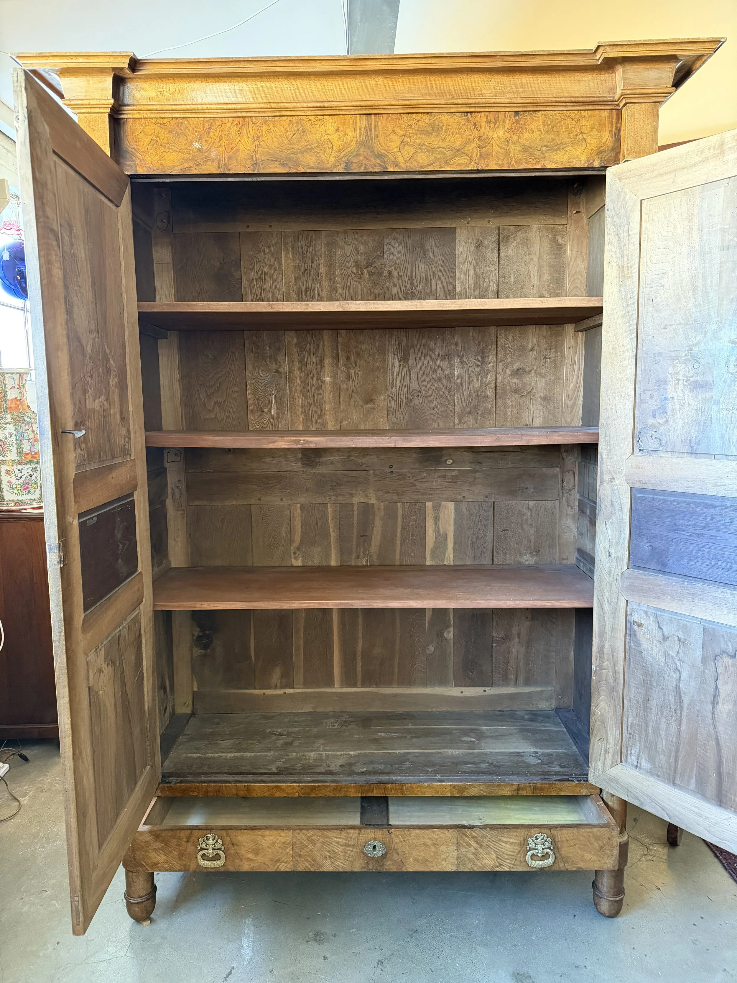 This is a picture of a fabulous French Empire walnut cupboard c1830 with the most beautiful colour and original hardware.