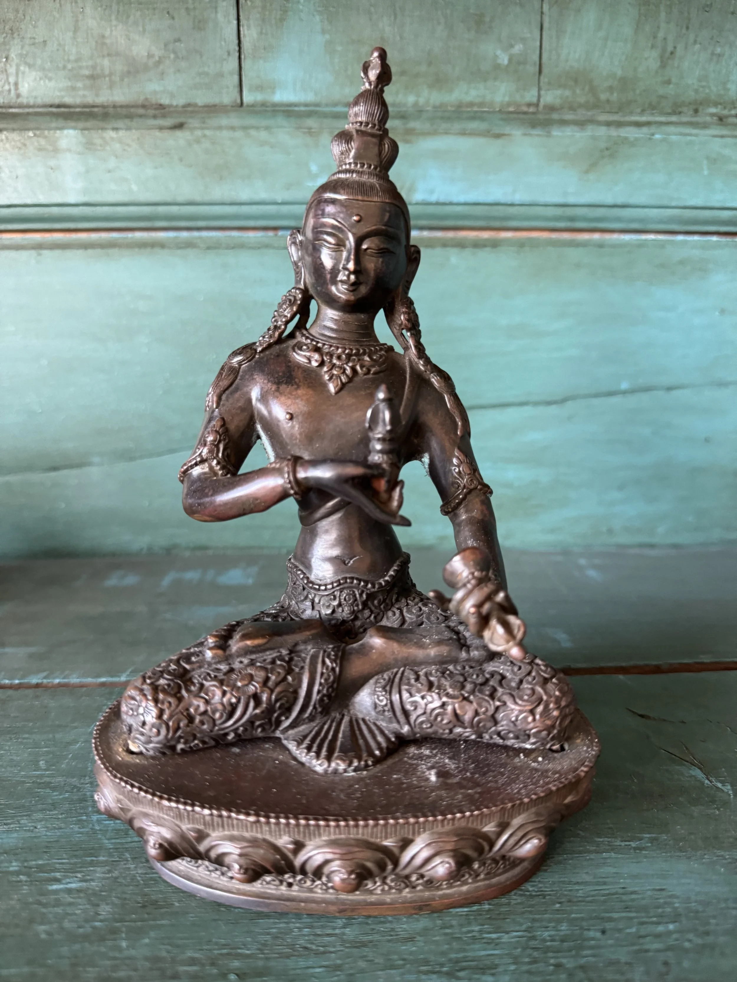 This is a picture of a beautifully patinated late 19th century Nepalese bronze Vajrapani Buddha.