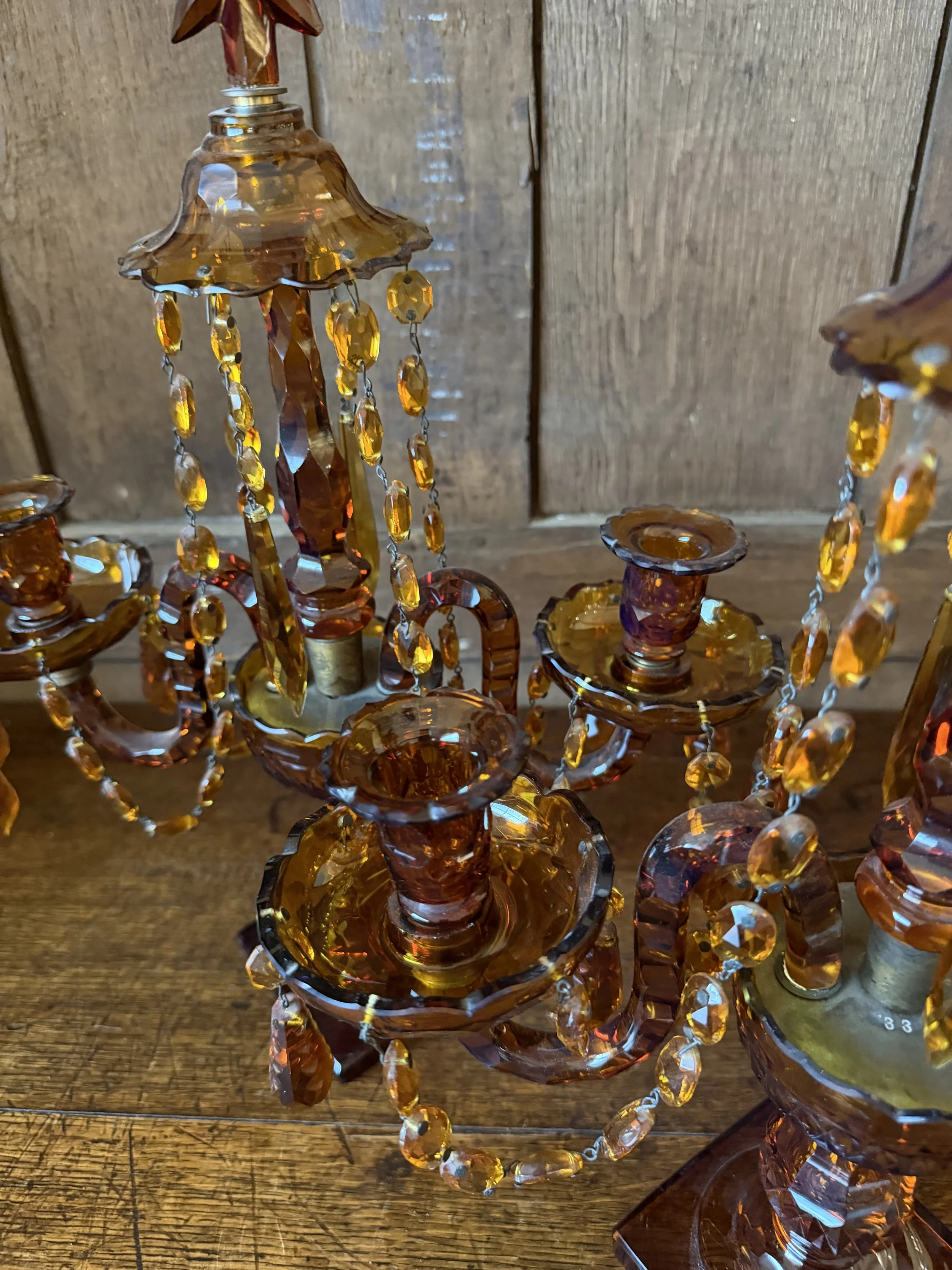 This is a picture of a fabulous pair of Edwardian Georgian revival girandoles in amber glass c1900.