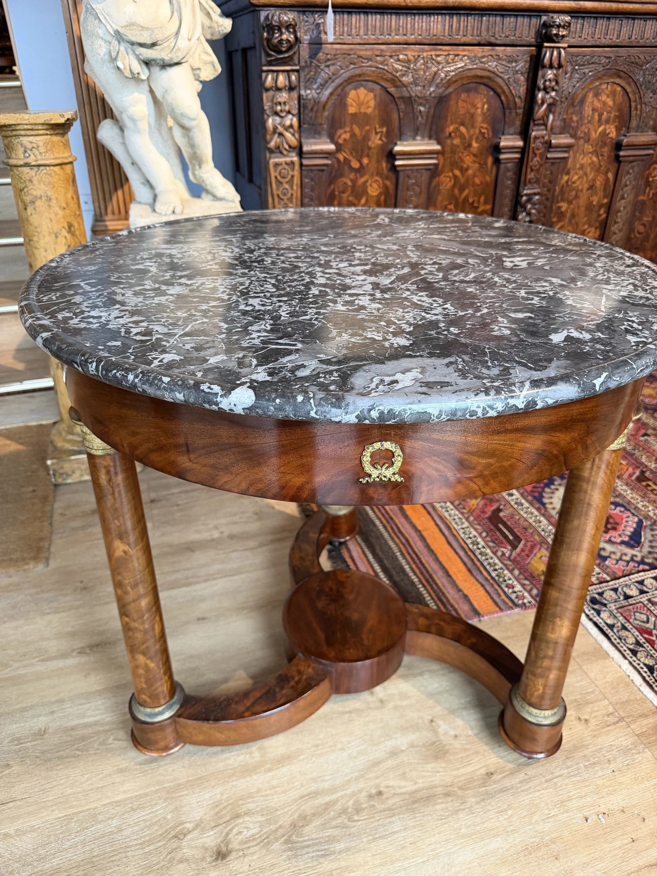 This is a picture of a very elegant French Empire ormolu mounted mahogany marble topped guéridon c1820.