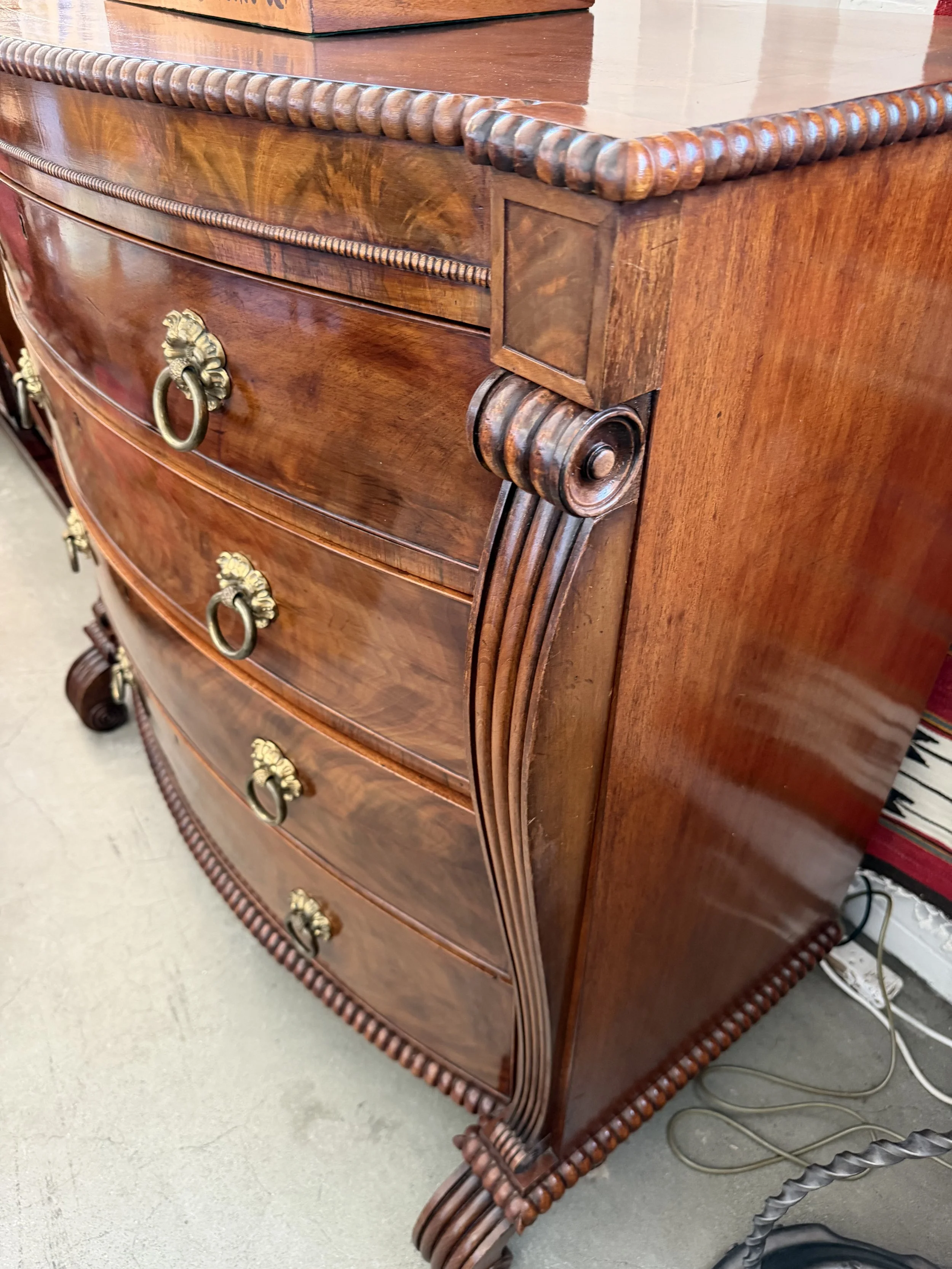 This is a picture of a superb George IV period mahogany bow front chest of drawers retaining it’s original brass ring handles, Channel Islands origin, c1825.