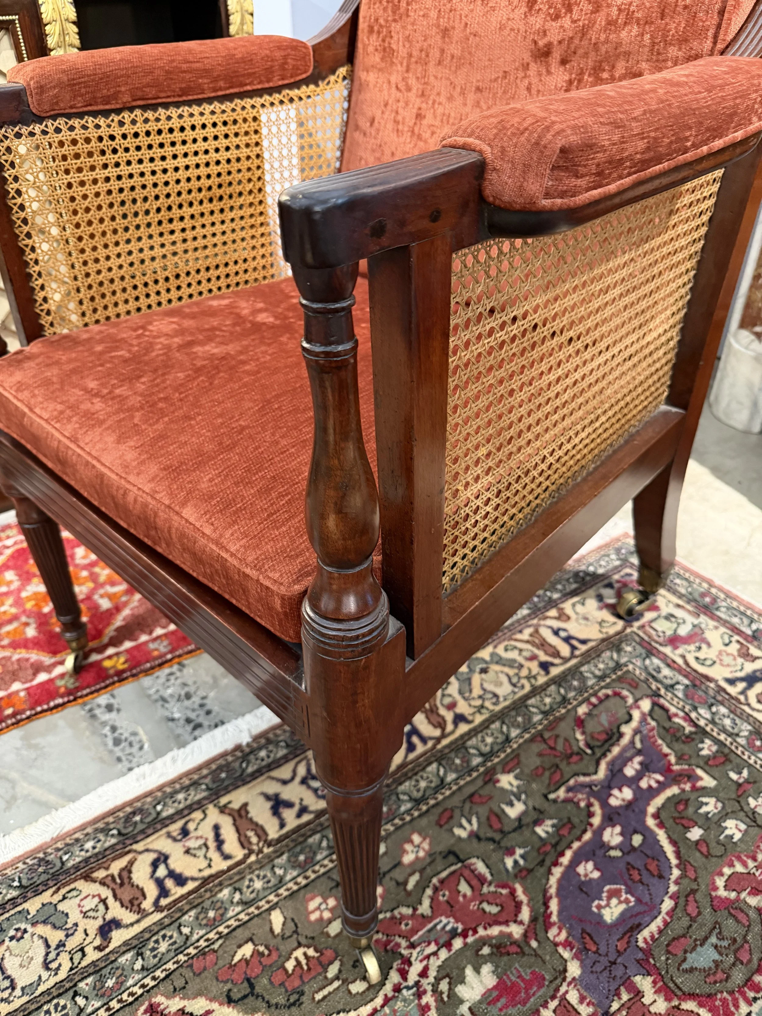 This is a picture of a very comfortable caned mahogany Georgian library armchair c1800.
