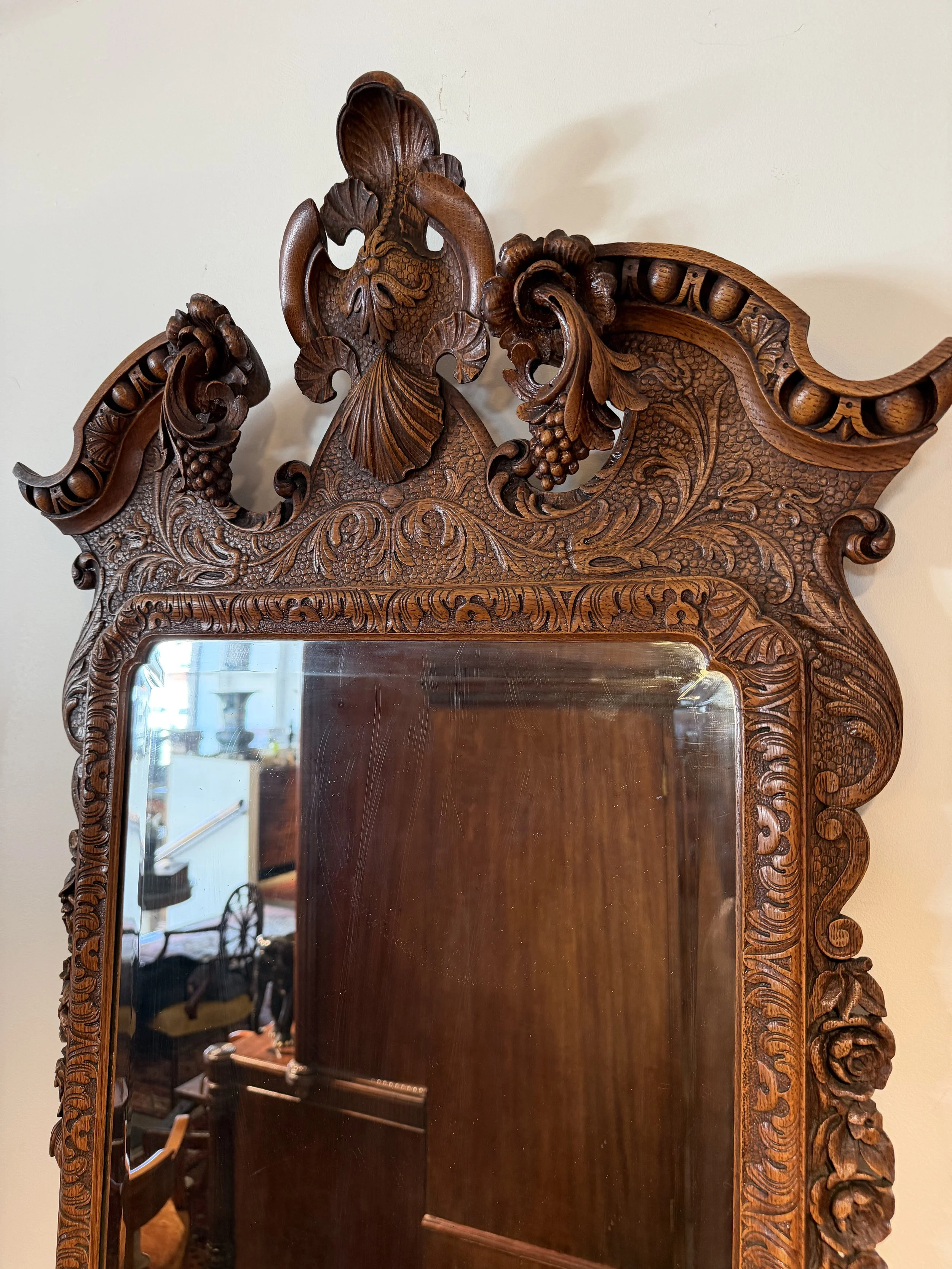 This is a picture of a very stylish late 19th century carved oak Georgian revival mirror.