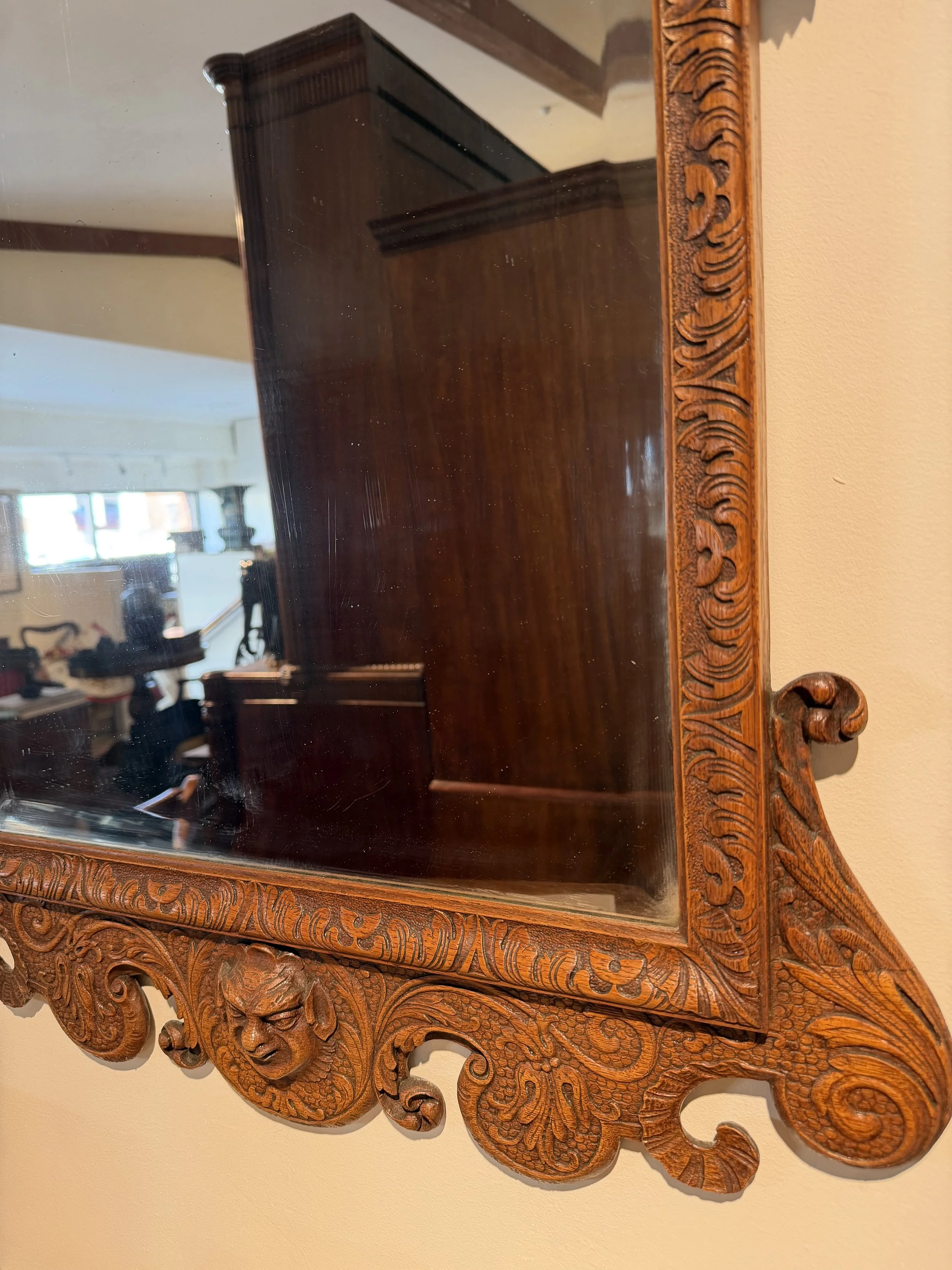 This is a picture of a very stylish late 19th century carved oak Georgian revival mirror.