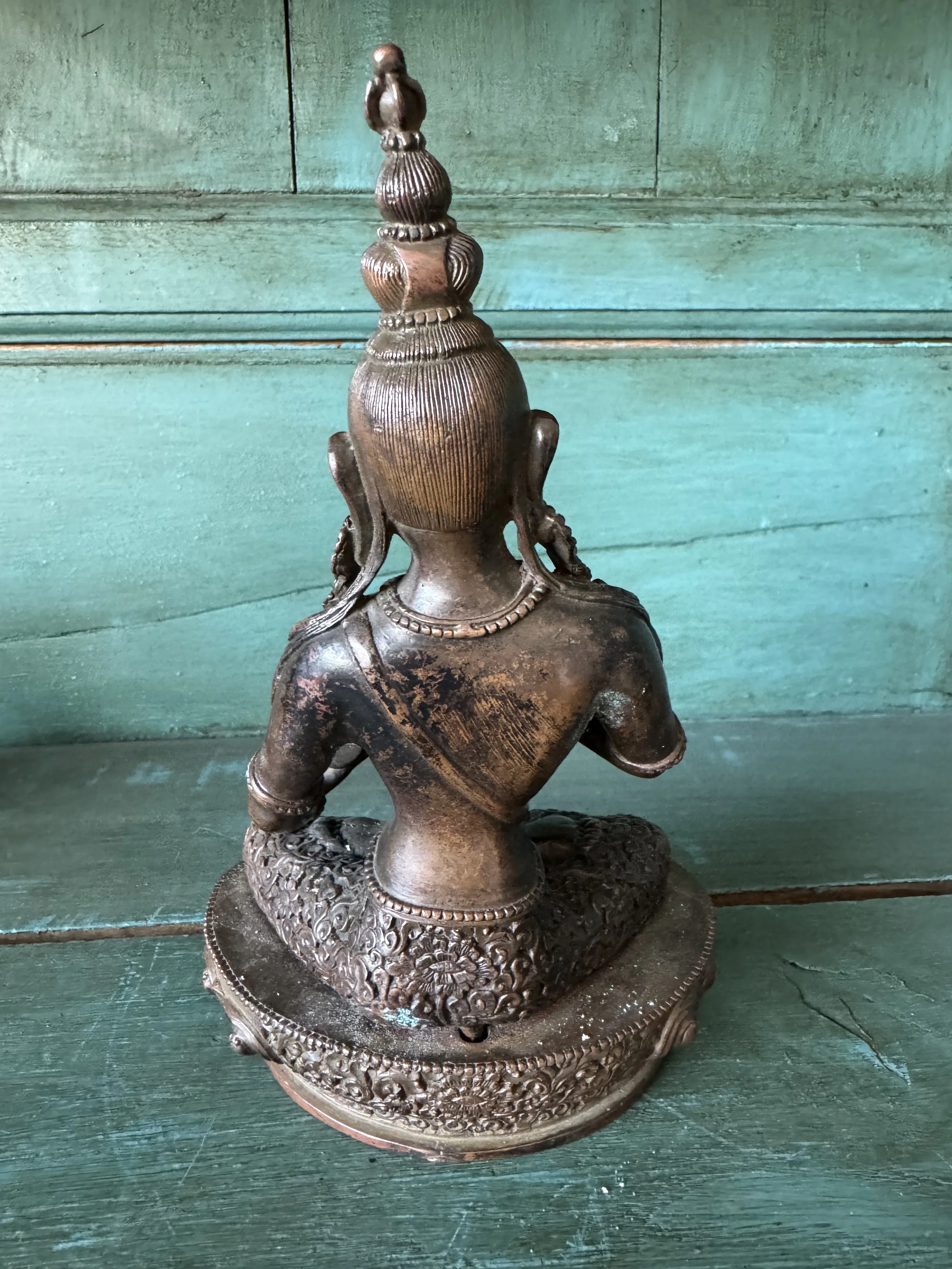 This is a picture of a beautifully patinated late 19th century Nepalese bronze Vajrapani Buddha.