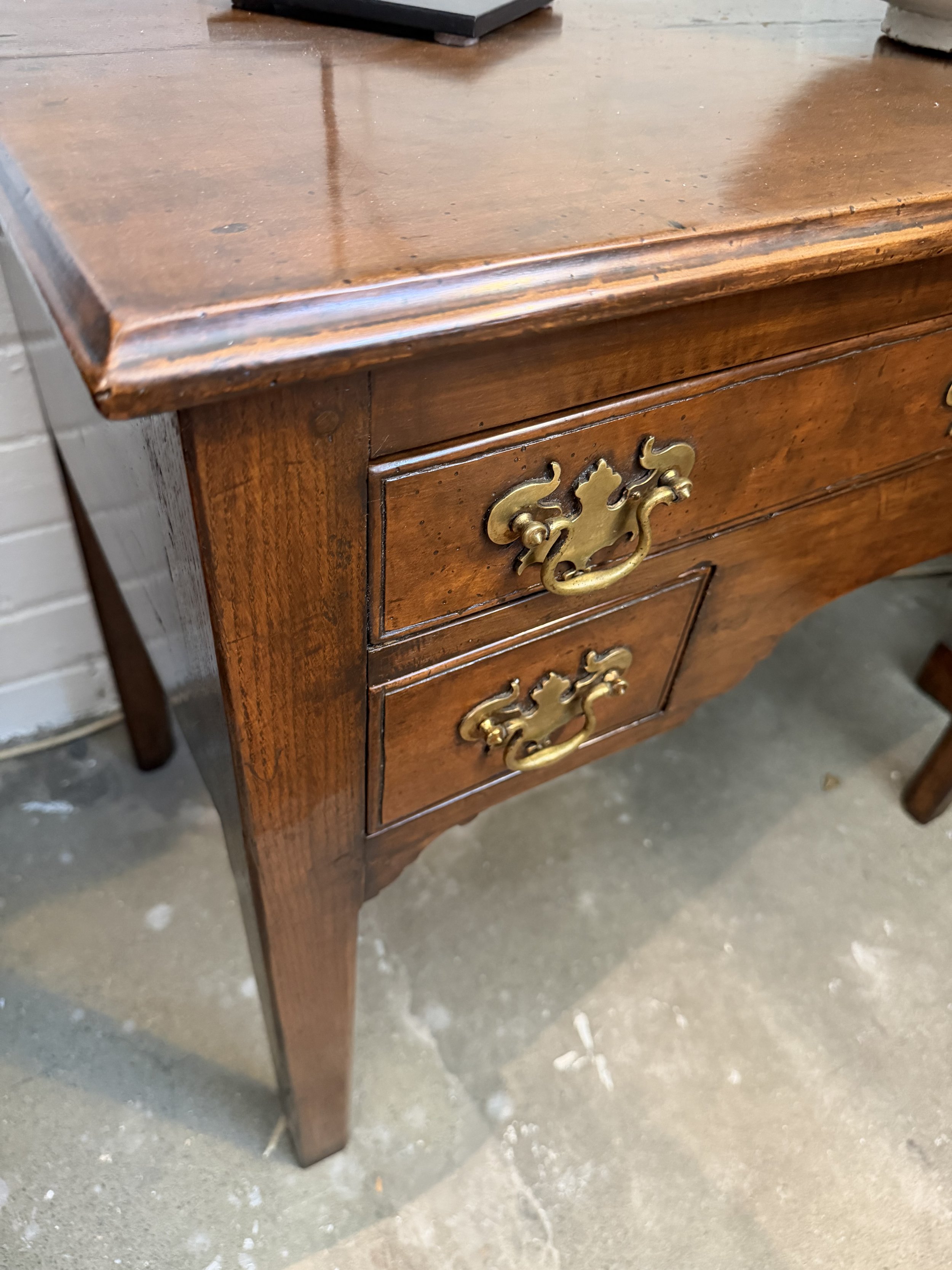 This is a picture of a lovely George III period fruitwood lowboy c1780.